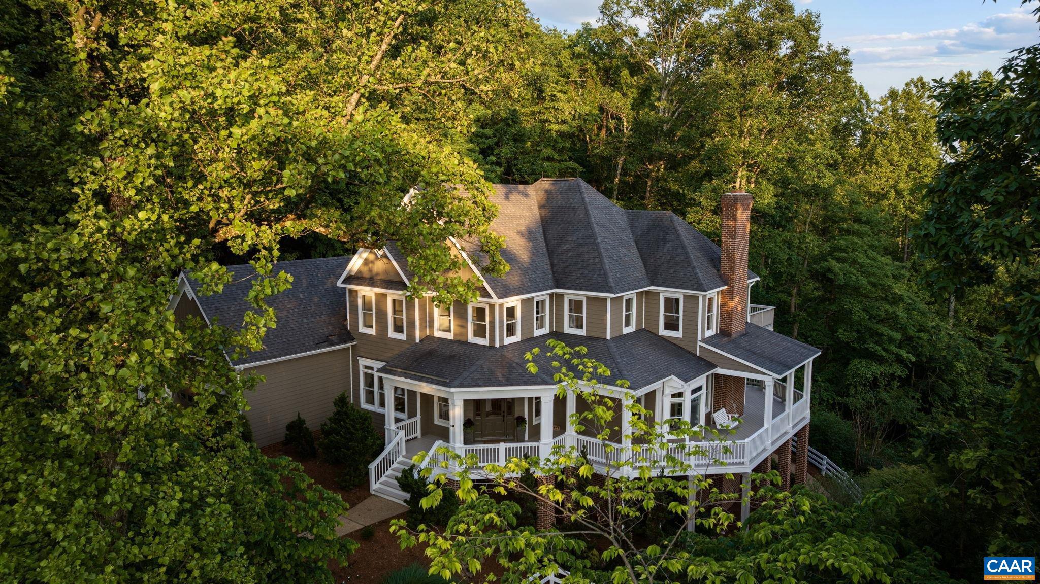 Have you ever dreamed of a totally remodeled "Park Street Style' home offering easy access to downtown and magnificent mountain views? Welcome to 2556 Summit Ridge Trail in Ashcroft. The architectural integrity of the home is evident with the generous wrap around porch framed by mature trees and majestic Blue Ridge Mountains. The welcoming foyer with hand laid hardwood floors reveals a formal dining room, two staircases, and the kitchen/living room flanked by an abundance of glass. The newly renovated kitchen boasts new high-end appliances, lavish counter tops and design features to inspire the most seasoned chefs. Primary en suite offers privacy and the unique feature of a quiet sitting area with fireplace and a beautifully transformed bathroom. Another wing of the home has 3 bedrooms, sitting loft, private bathrooms, and a luxurious roof top deck revealing the mountain views. Terrace level maintains the exceptional architecture with large family room with stone fireplace, bar and full bathroom. Three fireplaces and a three car garage completes this exceptional home.,Granite Counter,Painted Cabinets,White Cabinets