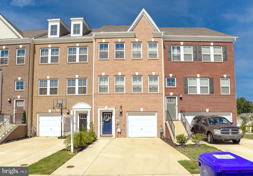 Welcome to this impressive 2,959+/- square foot three-bedroom townhouse that boasts a modern open concept floor plan full of natural light with countless designer amenities. Get ready to flex your cooking skills in the chef-approved gourmet kitchen with custom top-of-the-line cabinetry, stainless appliances including a vent hood and double oven, and hand-selected quartz counters that compliment the space as a whole, and tons of counter space along the oversized island with pull-up seating - great for hosting! The kitchen opens to both the living room and dining room, allowing conversation and laughter to flow throughout the home while entertaining. Enjoy your rear yard that has the perfect balance of patio and grass with the security of a fenced-in yard.  

Work remotely from the top floor loft with access to the rooftop deck overlooking the vibrant neighborhood below. End your day of work or play in total luxury within the upper-level primary bedroom designed to evoke utter tranquility with a gorgeous tray ceiling detailing a walk-in closet and an attached ensuite with dual sinks, a soaking tub, and a large shower. Some of the numerous conveniences offered at this residence include spacious bedrooms, an attached garage, natural gas, luxury vinyl plank flooring, recessed lighting, ceiling fans, and access to community events and facilities, including a pool outdoor exercise equipment, and gathering spaces. This lavish townhouse is a short distance to Washington DC commuter bus, White Plains Regional Park, sports fields, shopping, and many historic sites and monuments - making this the ideal location for commuters looking for a slower-paced lifestyle.