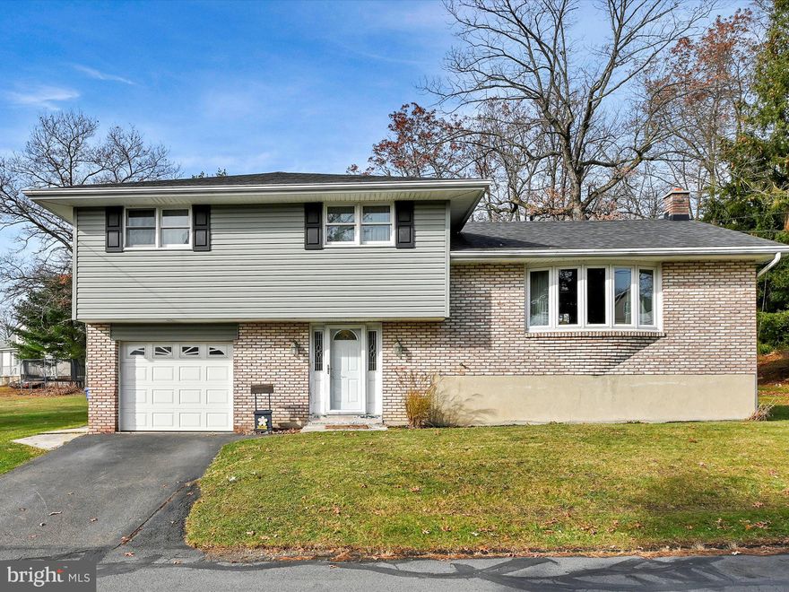 Buck Run beauty! Rare opportunity to call this desirable neighborhood home in this 3BR/1.5BA split level on a spacious .54 acre lot.  Entrance foyer leads to a cozy den and convenient guest half bath and a staircase to the remodeled main level with an open kitchen, living and dining room combination layout  The upper level has the three private bedrooms and a beautifully remodeled bath. If you want to enjoy the back yard view rain or shine, relax in your spacious enclosed sunroom.  The lower/basement level has the laundry area which is also perfect for all your storage needs or renovate for even more living space.  Newer roof, siding, windows,  attached garage,  laminate flooring throughout, high end appliances, and upgraded electric should put this property high on your must-see list!