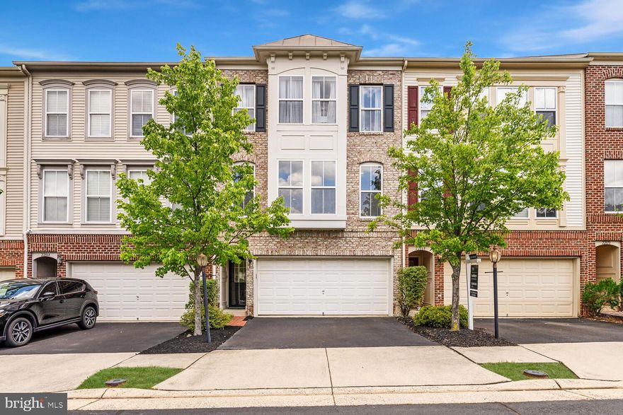 Experience the pinnacle of Brambleton living! This breathtaking, sun-soaked 3-bedroom, 2 full and 2 half bath townhome, situated in one of Northern VA's most coveted neighborhoods, has been masterfully remodeled to include a host of luxurious upgrades. With nearly 2,500 square feet spread across three impeccably finished levels, this home shines! 
<br><br> 
The main level features an open layout designed to enhance connection while preparing meals in the stunning gourmet kitchen, complete with quartz countertops, a sleek quartz waterfall island, ample cabinetry, and high-end stainless steel appliances. This space flows effortlessly into the spacious living and dining areas, highlighted by a custom fireplace, and extends seamlessly to the rear deck, ideal for indoor-outdoor entertaining. The family room provides a cozy retreat for reading or a productive workspace for those working from home.
<br><br>
The upper level provides an indulgent escape, showcasing a Primary Suite with a spa-inspired bath, dual walk-in closets, and a cozy fireplace. This level also includes two generously sized bedrooms, a stylish full bath, and a thoughtfully situated laundry room, enhancing both comfort and convenience.
<br><br>
On the lower level, you’ll find a spacious recreation room complete with a cozy fireplace, a convenient half-bath, and a walk-out to a beautifully landscaped, fenced backyard. Surrounded by mature trees, this outdoor space offers a peaceful and private retreat.
<br><br>
Conveniently situated near the vibrant Brambleton Town Center, this home offers easy access to a diverse array of dining options, an IMAX Cinema, a state-of-the-art Fitness Center, and a well-stocked Public Library. You'll also benefit from proximity to top-rated schools, community pools, a clubhouse, parks, playgrounds, and over 20 miles of scenic trails. Just minutes from major thoroughfares including the Dulles Greenway, Route 50, Route 28, Route 7, and the Metro, you'll enjoy seamless connectivity. Additionally, shopping, restaurants, and golf courses are all within close reach, enhancing the appeal of this beautiful townhome in Brambleton.