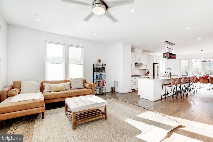 Welcome to 1035 Pendleton St, a standout 4 bedroom, 3 full and 2 half bath townhome in the heart of Alexandria. Formerly the model home for the community, this is the largest residence in the development, offering an exceptional blend of space, style, and location. Thoughtfully designed with open-concept living in mind, this home features expansive living and dining areas filled with natural light, ideal for both entertaining and everyday comfort.

The kitchen opens seamlessly to the main living space and features sleek finishes, ample cabinetry, and a large island that anchors the room. The home also boasts three generous living spaces, providing flexibility for hosting, relaxing, or working from home. You'll appreciate the convenience of two additional half bathrooms; one on the first level and another on the second floor.

Enjoy the outdoors with a large deck and a private rooftop terrace, perfect for unwinding or entertaining. The two car garage, complete with EV charging, offers rare convenience in this highly walkable area. Located just minutes from the charm of Old Town Alexandria, you’re close to award winning dining, boutique shopping, scenic parks, and have easy access to Metro and major commuter routes.

Combining space, comfort, and an unbeatable location, 1035 Pendleton St is a rare opportunity to own the premier home in this sought-after community. Schedule your private tour today!