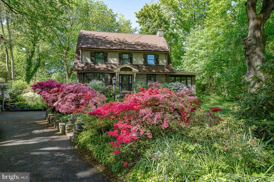 A lovely stone colonial with mature landscaping.  Beautifully maintained by current owner for over 50 years.
Center Hall gives you a view of the living room, dining room, sunporch and stairs.  French doors lead you into the living room has a stone fireplace ( gas) windows at front and rear.  The windowed sunporch has carpeting, an exit to side yard . It has heat and a/c.  The family room is at the rear.  Adjacent to it is a full bath
with stall shower. (this is an addition and could be used as in law suite)  A solarium has skylight and slider to deck.  Laundry room is off the kitchen.  The dining room has a large bay window which overlooks the garden.  Kitchen is eat in , has entrance to basement and O.E to deck.   Custom cherry cabinetry , some glass fronted,  Gas cooking, porcelain sink, dishwasher and very deep window sill over sink.  The second floor has four square bedrooms and hall bath with tub shower.  The third floor has large bedroom with sitting area and full bath with claw foot tub. Basement is full and walk out.  Garage is integral to house. Walk to Lower Merion Lower and Middle Schools