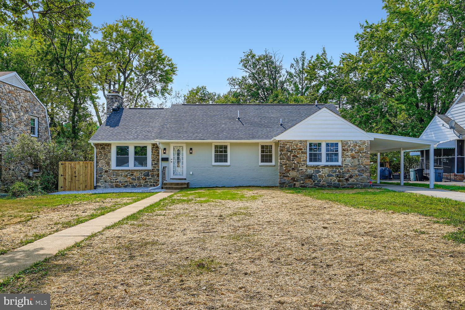 Looking for GRANDEUR, in a sprawling rancher, with all the space you desire? Well look no further, because this COMPLETLY NEW rancher, with nothing sparred in renovations, is where you want to reside! Unique layout, with rare square footage, carport, and great indoor–outdoor living. An open, light-filled main level showcases new LVP flooring, recessed lighting, and a stone fireplace that anchors the living area. The new refreshed white kitchen features granite counters, stainless steel appliances, and generous storage, flowing easily to open dining and living areas. The main level offers a large ensuite, with separate master bathroom , 2nd. bedroom, overlooking rear scenery, and an additional full bathroom. The finished lower level expands for entertainment, with a huge family room area, including a sleek wet bar/beverage fridge, multiple flex areas for media/workout/play, additional private 3rd. & 4th. bedrooms, and a separate full bath, laundry room with utility sink, storage space, and walk-out access. Enjoy a screened porch, off the new deck overlooking the spacious fenced backyard—perfect for everyday relaxing or hosting family & friends. Fresh exterior accents, new covered carport, new roof, new gutters, and ample driveway parking complete the package. Convenient Randallstown location close to shopping, dining, parks, and commuter routes.