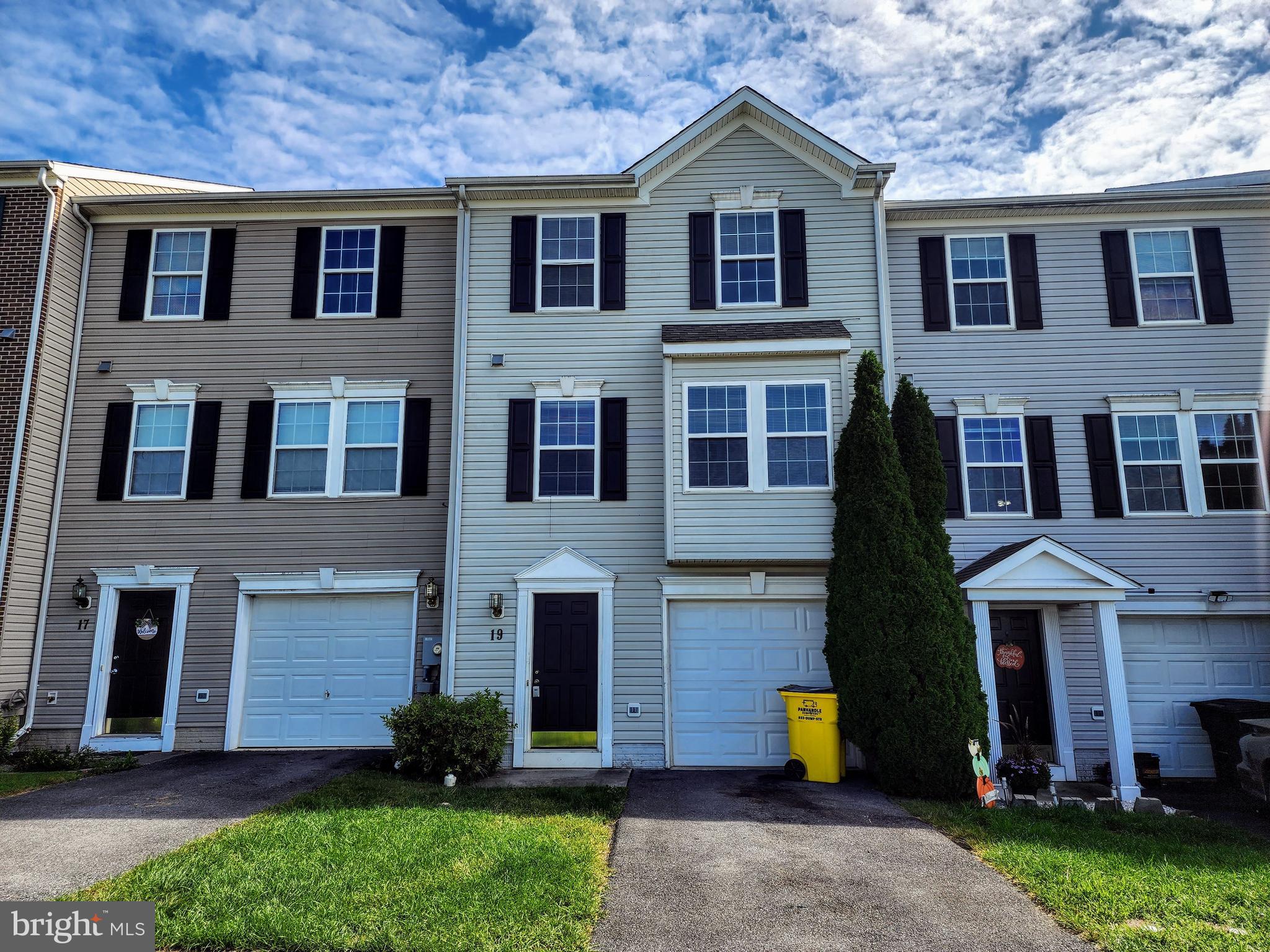 Experience the epitome of modern townhome living just beyond the borders of Martinsburg's city limits. This 3-bedroom, 3.5-bathroom residence offers a blend of comfort and convenience across its three spacious levels. On the lower level, you'll discover a one-car garage, a versatile finished room, ideally suited for a home office or den, and a full bath. Step through the walkout to the backyard. The main level features an inviting eat-in kitchen and dining area that seamlessly transitions to the deck, and a generously sized living room and a convenient half bath. Ascend to the upper level to find the private primary suite, complete with a full bath with separate tub and shower and a generously proportioned walk-in closet. Two additional bedrooms and another full bath provide ample space for family members or guests. Tenant screening includes a requirement of 3 times the rent in income, as well as credit and criminal background checks. We also welcome one dog on a case-by-case basis, with considerations for size and breed to ensure the comfort and safety of all residents. ***Property is currently undergoing some repairs and upgrades, including LVP flooring on lower level. Expected availability is Mid-October***
