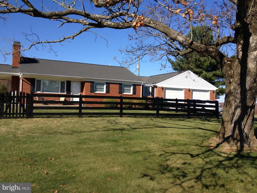 GORGEOUS PASTORAL VIEWS IN ALL DIRECTIONS, BUT ONLY 3.5 MI TO TOWN. SOLID BRICK RAMBLER-CLEAN AS A WHISTLE!! HWD FLRS & CERAMIC TILE THROUGHOUT/STONE FP-LR, REMODELED BATHS & KIT/ NEW INDOWS/FULL UNFIN BSMT/GAS HEAT & HW/ OVER SIZED 2 CAR GAR (30' X 29') WITH 220 LINE  FOR THE HOBBYIST WITH WORKBENCH. PAVED DRIVEWAY,  COVERED PATIO TO ENJOY COUNTRY. LG FENCED AREA FOR PETS. SELLER SAYS MAKE OFFER!