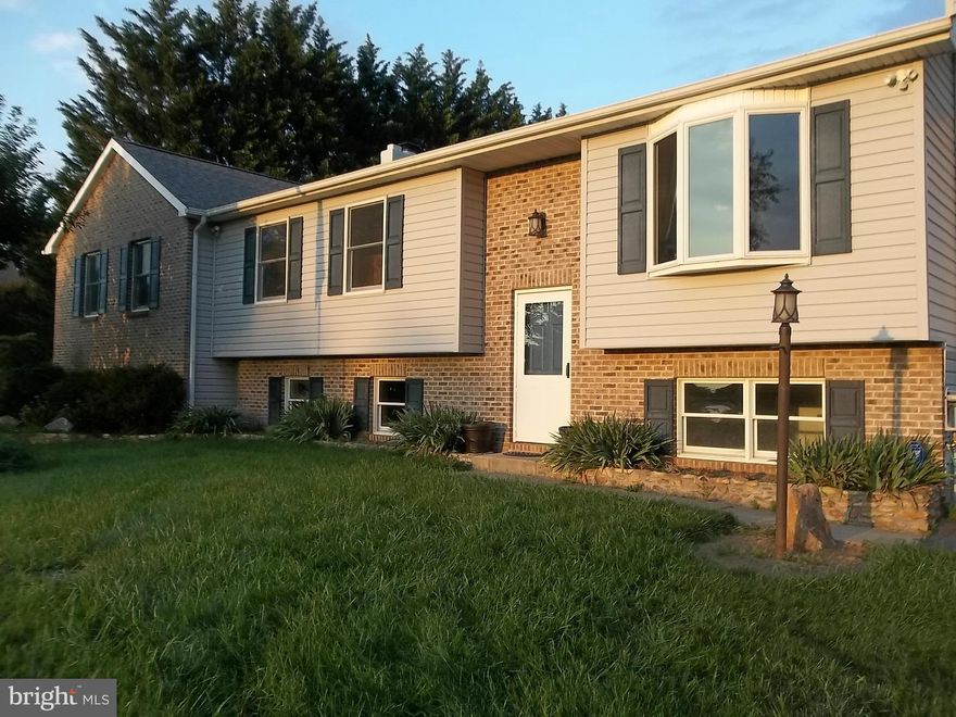 Only a relocation makes this home available !  Huge rooms,  Close to 3000 sq foot of living space Plus a sun porch . Stainless kitchen appliances . Possible  4 bedrooms ,3 full baths , Fireplace , Extra parking ,  Backs to farm land . Beautiful country setting . Don't let this one get away . Move in ready .