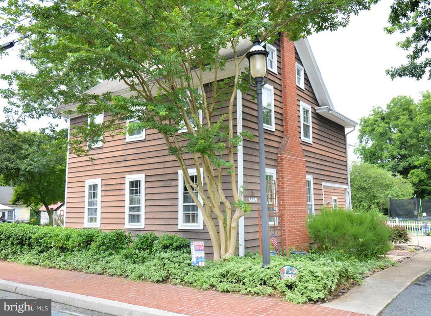 Welcome to 6539 Quantico Road! This  beautiful piece of property is located in the Historic town of Quantico. The home is located on over 1+acre of beautiful green land.  This home is conveniently located just 15 minutes from Cedar Hill Marina and Roaring Point Beach. If you enjoy country living with a Mayberry feel, this could be the home for you! In the main house aka the Historic Brady House, on the first floor, you will find the large kitchen with bright white cabinets, plenty of storage, a fireplace, and access to the deck and backyard. Also off the kitchen, you have access to one full bathroom featuring new patterned tile flooring and a full laundry room with an upgraded washer and dryer.  As you continue through the home, you will enter the spacious dining room with a wood stove that can hold a large family dinner or gathering. Next is the spacious living room with a wood burning fireplace.  On the second floor, you will find office space, 3 large bedrooms,  and 1 full bathroom.  As a surprise, in the back bedroom, you will find a door that leads to a private stairwell which gives you direct access to the bathroom downstairs. The bedroom sizes in this home are very hard to find. Next, you will make your way up to the 3rd floor which is the walk-up attic space, fully floored and provides the storage space that everyone needs! Next, is the beautiful outdoor living space the home offers. A section of the land is fenced in with complete access to the rest of the beautiful piece of property this home sits on. You can have the garage to store a car or use it for your own personal workshop. Some of the most recent upgrades in this home include a new furnace, new well pump, new hot water heater and refrigerator. This charming, quaint home has seen so much love and are ready for a new family to fall in love too.  Call to schedule you personal tour today.