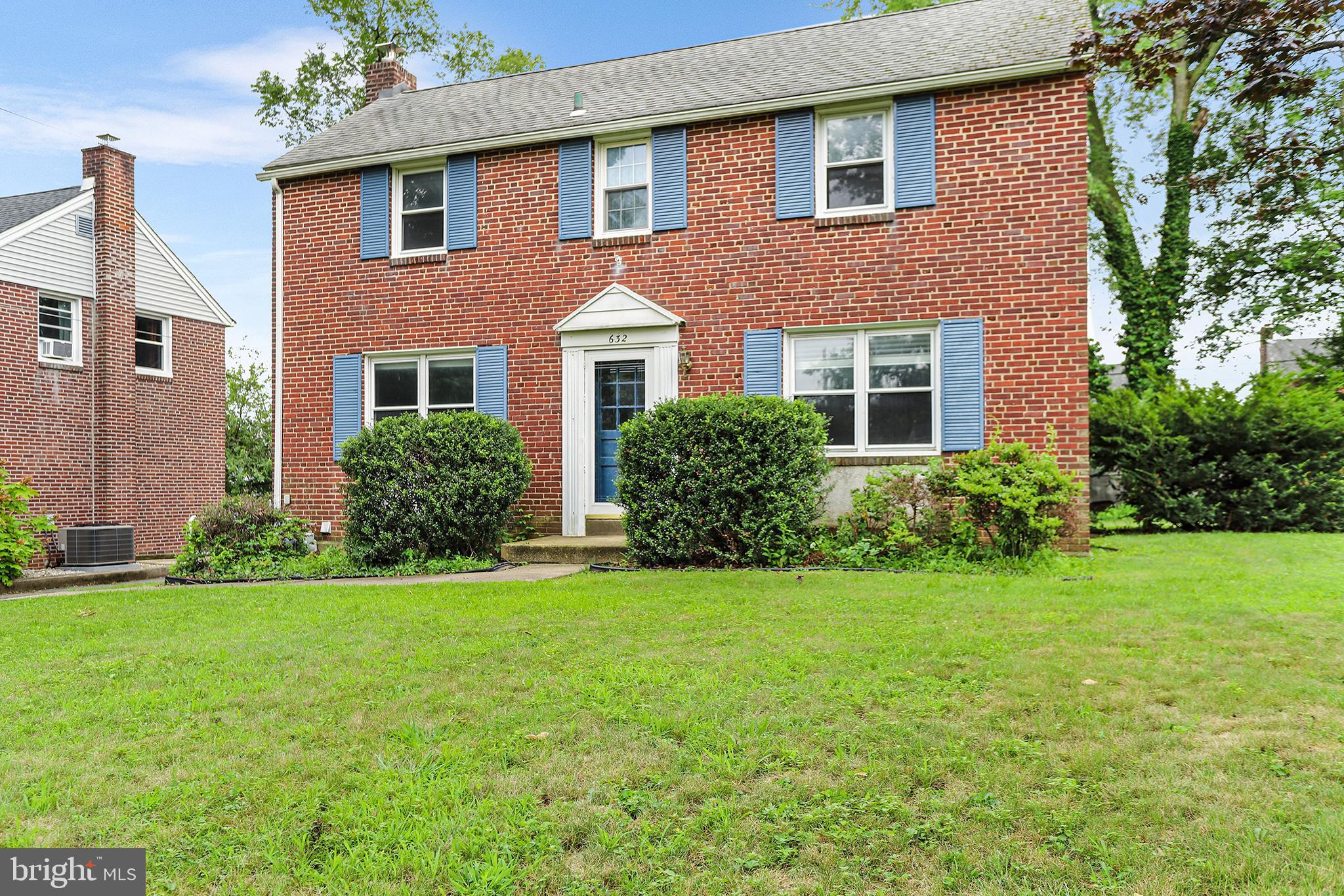 Welcome to this expanded 3 BD, 2 BA Colonial located in the sought-after Colonial Park neighborhood of Springfield Township. Nice curb appeal of brick with attractive blue shutters and large front yard overlooking a quiet tree-lined street. The main level features a bright living room with dark wood floors, neutral paint and recessed lighting. This same modern flooring and color scheme continues into the dining room with direct access to the newly renovated kitchen. The impressive kitchen features white cabinets, mosaic tile backsplash, deep farmhouse sink with quartz countertops as well as an attractive wood accent wall with views into the great room for easy entertaining. Off the great room is a newly updated bathroom convenient for guests. Upstairs are two spacious secondary bedrooms both with wood floors and overhead lighting. Wood flooring continues into the primary bedroom with a large closet and character in the charming cove ceiling. Bedrooms share a full bathroom with white vanity and tiled tub shower combination. The partially finished basement has LVP flooring and offers opportunity for additional living space, ample storage options and laundry. Additional highlights include off-street parking for several cars, flat backyard with a patio and a storage shed. Conveniently located within walking distance to Ellison Glen Park, award-winning schools and an easy commute to Philadelphia, New Jersey and Delaware.