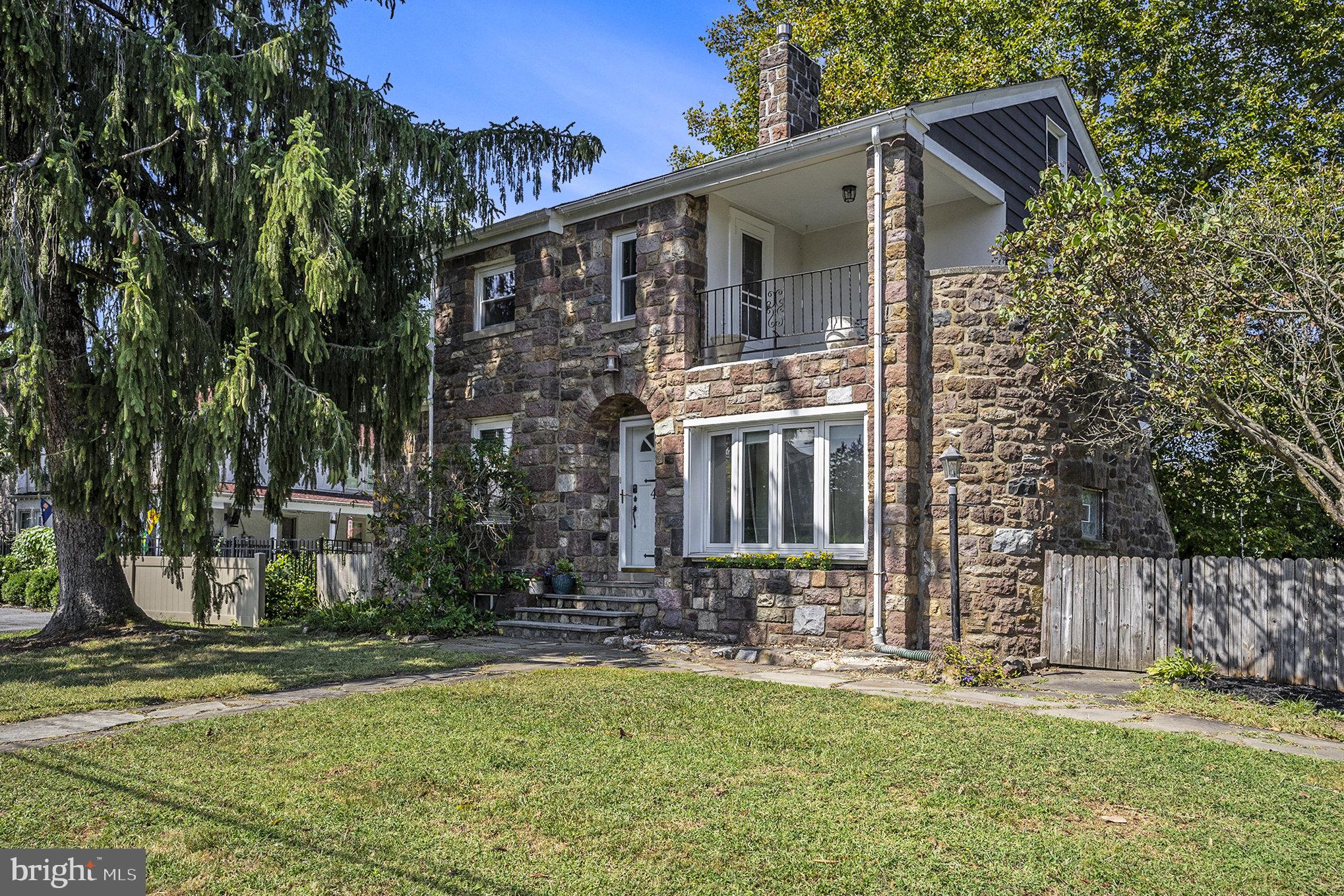 This charming 1940s detached home offers a perfect blend of classic character and modern comfort, nestled in the popular town of Phoenixville, recently awarded the best small town in America. With 1,620 sq. ft. of thoughtfully designed living space, this lovely home features three inviting bedrooms and two full bathrooms, ensuring ample room for relaxation and privacy. Step inside to discover a warm ambiance highlighted by beautiful hardwood floors and built-in cabinetry. Sip a cup of coffee or tea at the breakfast bar in between the dining room and kitchen or take it out back on the spacious patio. The living room, anchored by a charming wood-burning fireplace with a beautiful mantel, creates a perfect gathering spot for chilly evenings. The 2nd floor laundry area was conveniently moved outside the bedrooms for ease of use. Additional noteworthy features include central air conditioning, a charming curved stone entryway, bonus "office" room off the main living space complete with 2 closets and a huge bay window, main bedroom cedar closet as well as a door from the this room that leads to a private balcony with direct stairs to the backyard. Outside, the property boasts almost a half acre lot, complete with a detached carport and an asphalt driveway that accommodates multiple vehicles. Relax on the balcony in the front of the house or on the flag stone patio surrounded by exterior lighting that enhances the evening atmosphere. A handy shed provides additional storage for gardening tools or outdoor equipment. Located in a peaceful suburban neighborhood, this home offers a perfect retreat while remaining conveniently close to local attractions. 4 Rossiter Ave is just a quick 15 minute walk to the thriving life of downtown Phoenixville (see aerial photo) full of restaurants, breweries, coffee shops and tons of unique shops. Experience the comfort and charm in this quaint cottage-like home, where every detail has been designed with care. Schedule a private tour today!