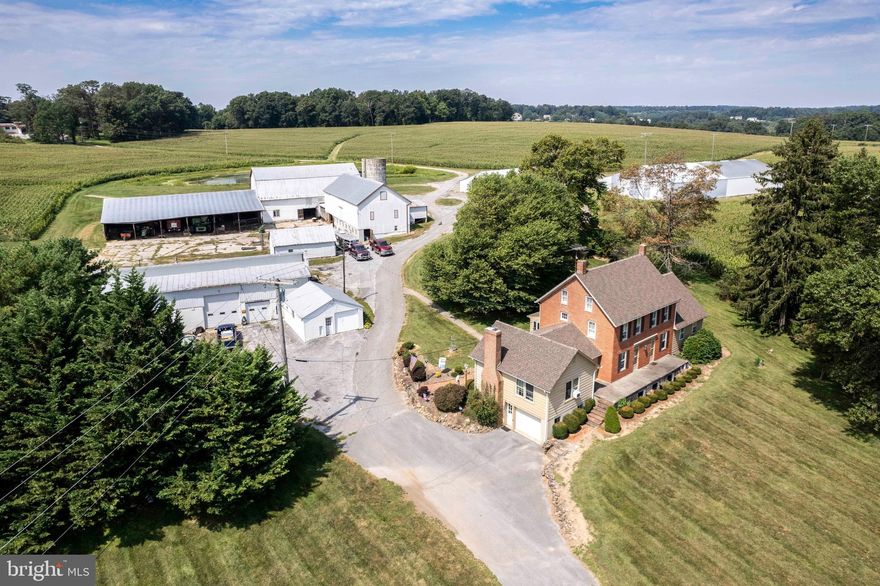 *Discover a rare opportunity to own an expansive 247-acre working farm nestled in the heart of Carroll County, Maryland. This exceptional property offers multiple building lots with subdivision potential, while still providing the option to place land into preservation for long-term value. The centerpiece is a stunning 3,000+ sq. ft. colonial home, featuring 4 bedrooms and 2.5 bathrooms, offering both charm and modern comfort.  The farm boasts three serene ponds and an impressive array of outbuildings, including a custom 4-bay garage complete with HVAC and a bathroom, a large bank barn with an attached machine port, a 3-bay mechanics garage, a smaller hay storage barn, and two large pole barns for equipment storage. Additionally, there are multiple sheds, a machine shop, silos, and a grain drying bin production facility (currently inactive).  The sale includes the main home and outbuildings, spanning across several tax parcels for a total of 247.8 acres (150.9 acres at 2200 Fairmount Rd, a 6.02-acre parcel, a 20.35-acre parcel, and a 70.525-acre parcel). Approximately 190 acres are tillable, making it ideal for agricultural pursuits. There is also the potential for 14 additional buildable lots, though buyers should verify any subdivision plans with county planning and development.  This is a truly unique opportunity to own a piece of Carroll County's rich farming heritage. Professional interior photos coming soon*This listing is also tied Farm listing MLS MDCR2022448 and Lot listing MLS MDCR2022764*