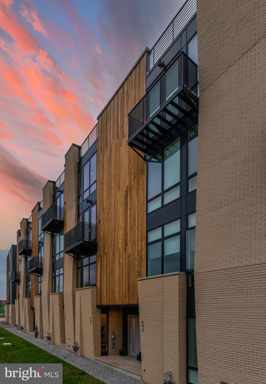 Welcome to the model home at Liberty Square - This fully upgraded city house features 4 BR's and 4.5 BA's in approximately 3k square feet of contemporary urban living in a very desirable Northern Liberties location.  Brought to by local premier Builder/Developer, PRDC Properties and Architect/Designer Atrium Design Group this is a truly fabulous house.  Enter into a foyer with coat closet and an adjacent first floor bedroom that can be converted into a home office, ideal for today's work from home lifestyle.  Access to your convenient 2-car attached garage.  
Ascend to a grand living floor with 10 foot high ceilings and dramatic 8 foot high doorways.  Large living room with huge windows facing south affording incredible natural light.  A linear gas fireplace with custom tile surround is ideal for cozy winter nights and entertaining.  Large dining area plus a true Chef's Eat-in Kitchen featuring European style flat-panel cabinets by Porcelanosa, white quartz counters and high-end Bosch appliances including French door refrigerator, cook top, vented hood, wall oven and microwave and dishwasher.  Huge picture window plus access to walk-out balcony ideal for summer grilling.  A convenient powder room is tucked in the hallway.
Upstairs are 2 guest suites each with their own en-suite bathroom plus a lovely center sitting room as well as convenient laundry room.
Ascend to your Primary Suite oasis featuring a massive Bedroom facing south, a full center dressing room with custom closet built-in systems (to be installed) and a spa-like bathroom with step-in shower, a glamorous freestanding soaking tub in front of a window, 2 separate vanities as well as a separate water closet makes one feel as though they are in a living in a luxury hotel suite.
Your oversized roof top deck, which is fitted out with custom European outdoor tile by Porcelanosa, affords 360 degree panoramic views including explosive Center City skyline and sunset views.
Finished lower level with custom wet bar and full bathroom is ideal additional living space for media room, home office, home gym, play room or guest quarters.  Approved 10-year property tax abatement.  A truly exceptional city house in a great location with easy access to Center City, transportation, major highways and the suburbs.