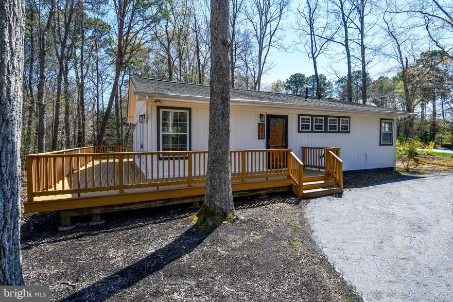 Rare Find – Upgraded, Spacious & Perfectly Located! This beautifully updated rambler is just 5 minutes from  Solomons/Lusby shopping, dining, and beaches! Beautiful lot  partially wooded lot, this home is filled with natural light and modern upgrades. The open floor plan is perfect for entertaining, featuring a gorgeous kitchen with granite counters, upgraded cabinetry. Sliding glass door leads to a large deck.  The new gleaming LVP floors and  large windows make the living area feel spacious, bright, and welcoming. The space flows into the kitchen, which has been renovated top to bottom with all new stainless steel appliances and custom cabinetry. Inside, you will find 3 generously sized bedrooms, all with ample closet space a while the bathrooms have been completed updated with all new fixtures throughout.  This community offers the perfect blend of peaceful living and recreational opportunities. Commuting to PAX Naval Base is a breeze from this location.