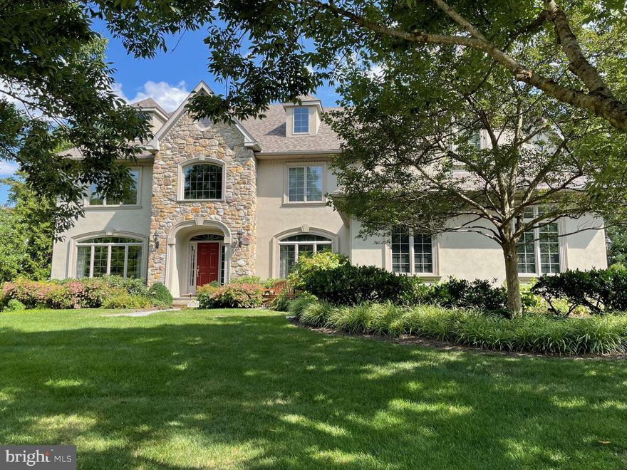 Welcome to this elegant, stunning, custom built home located in the prestigious and desirable neighborhood of Spring House Farm in Lower Gwynedd township. This home offers over 5100 square feet on a quiet cul-de-sac street with 5 bedrooms, 3 full baths and 2 powder rooms. Entering the home you are greeted by the grand two-story front to back foyer detailed with beautiful hardwood flooring, crown molding and classic wainscoting. Directly off the foyer, to the left, is the luxurious living room adorned with custom built-in cabinetry, piano nook with bay window, and hardwood flooring. To your right, off the foyer, is the grand formal dining room featuring dramatic lighting, wainscoting, crown molding and hardwood flooring. The vast foyer also leads to the French doors of the private study with gas fireplace, hardwood floors crown molding and beautiful natural light. Adjacent to the study is an elegant powder room. The customized gourmet kitchen features beautiful granite countertops, stainless steel appliances, sub-zero refrigerator, large center granite-topped island with barstool seating, custom tile backsplash, Medallion wood cabinetry and wet bar. Adjoining the kitchen is the sunlit morning room that offers delightful views of the backyard gardens. This room includes custom wainscoting and direct access to the substantial back patio. Open to the morning room and kitchen is the splendid great room adorned with a wall of windows, spacious vaulted ceiling, remote controlled gas stone fireplace and built-in wood cabinetry. The open back hall leads to a second powder room, built-in storage, three-car garage with two 50amp EV charge ports and back stairway with second-floor access. The second floor offers a magnificent primary suite detailed with a sunlit sitting area, tray ceiling and dual walk-in closets. The spacious ensuite bath features thermostat controlled electric radiant tile floor heat, two stand-alone vanities, a jacuzzi tub, tiled shower and sky lights. The second floor continues with four additional carpeted bedrooms. All four bedrooms include ample closet space and share two jack-and-jill bathrooms with two stand alone vanities each and thermostat controlled electric radiant tile floor heat. In addition, this floor includes a study area with built in desk and bookcases and a laundry room with cabinet storage and sink. Continue up the open staircase to the large attic which provides approximately 900 square feet of window lit unfinished space. The basement of this home offer 2,450 square feet of unfinished space with 9 foot ceilings and Bilco outdoor access doors. Step out of the home through the foyer glass door to the expansive patio complete with built-in outdoor kitchen and ample seating and dining furniture. The patio is the perfect entertaining or relaxing area with private yard, professional landscaping and ambiance lighting. Additional home amenities and upgrades include a holiday lighting package, sprinkler system and multi-room first floor audio speakers. This beautiful non-smoking, non-pet home is located in the Wissahickon school district and offers easy access to major highways, transportation, restaurants, shopping, trails and golf courses.