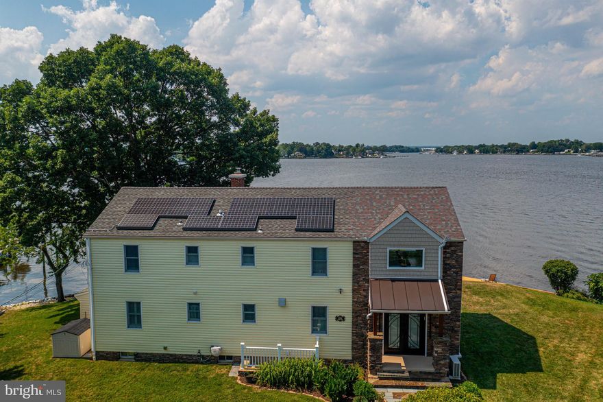 An Unparalleled Waterfront Estate Awaits! Prepare to be captivated by the extraordinary 2334 Martin DRIVE, a waterfront gem offering an astounding 280 feet of direct water frontage. This is the rare opportunity you've been waiting for -- a meticulously maintained luxury home with  water views from every room in the house! Step inside to discover custom interiors and an inviting open floor plan designed for seamless living and entertaining. Enter into the great room and marvel at the floor-to-ceiling windows, showcasing the panoramic water vistas. Bask in the natural light streaming in as culinary prep, dining, and lounging go hand-in-hand. This exceptional residence features three spacious bedrooms, two stylish bathrooms (including a luxurious en suite with a one-of-a-kind copper tub), and a flexible main-level space ideal for a home office, den, or easily converted into a fourth bedroom. Enjoy the elegance of hardwood floors, abundant closet space including a bedroom-sized walk-in closet, and an expansive yard dotted with flowering bushes, fruit trees, and a massive mature white oak that shelters the deck from the blistering afternoon sun. Your private oasis extends to a sandy beach area and a  40-foot pier.Unwind in the privare hot tub off the deck, overlooking the tranquil waters. Get prepared for great views of the Middle River fireworks and the lighted boat parade!  This is waterfront living at its finest. Sitting on a great corner lot with high elevation and a low traffic road, this home sits in the premiere neighborhood on the peninsula. Don't let this once-in-a-lifetime property slip away!