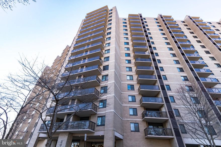 Welcome to this stunning, modern 2-bedroom, 2-bathroom condo in the sought-after Watergate at Landmark community. Recently renovated with contemporary finishes, this stylish unit boasts an open-concept layout, sleek design elements, and breathtaking views—perfect for both relaxing and entertaining.

Step into a bright and airy living space featuring floor-to-ceiling windows that fill the home with natural light and offer access to a private balcony with panoramic views of Alexandria’s skyline and lush greenery. The elegant dining area is adorned with modern pendant lighting, setting the perfect ambiance for gatherings.

The gourmet kitchen is a chef’s dream, boasting sleek white cabinetry, quartz countertops, stainless steel appliances, and a stylish tile backsplash. A convenient in-unit washer and dryer add to the modern conveniences.

The spacious primary bedroom includes a large closet and an en-suite bath with a contemporary double vanity, illuminated mirrors, and a luxurious glass-enclosed tub/shower. The second bedroom is equally inviting.

All appliances are modern and less than 5 years old. The building offers a trash chute and recycling on each floor. Pest control is professionally managed by the HOA office for peace of mind.

Enjoy the unparalleled lifestyle of Watergate at Landmark, a modern, resort-style gated community offering top-tier amenities. Residents have access to both indoor and outdoor pools, a fully equipped gym, a relaxing sauna, and ample parking for both residents and guests. With central air, reserved parking, and stunning contemporary updates throughout, this condo is a rare gem—perfect for experiencing the best of Alexandria living!