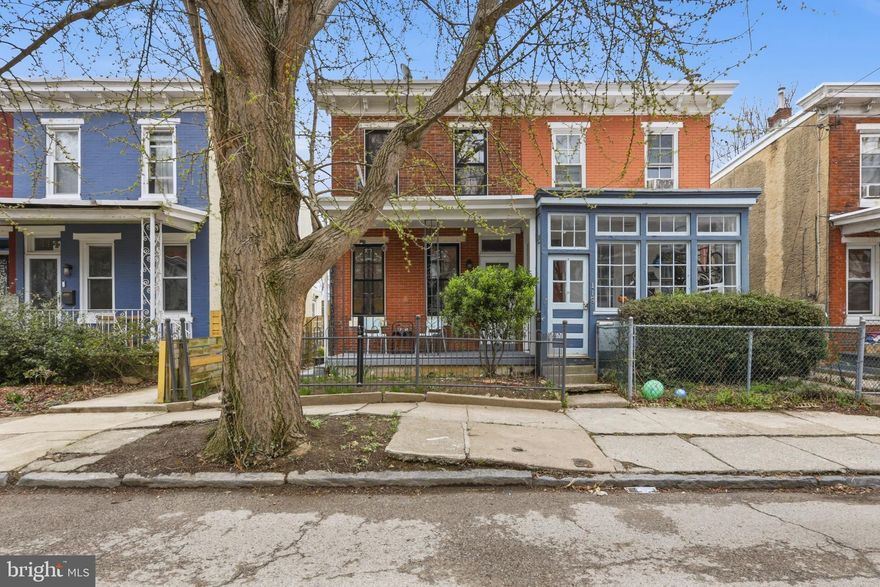 Welcome to 116 W Duval Street — a sweet 2-bedroom, 1.5-bath twin tucked away on one of Germantown’s most peaceful residential streets. With original character, generous natural light, and a private backyard, this home is full of potential and warmth. The main level includes a spacious living room with tall windows and hardwood floors, flowing seamlessly into a full-sized dining room and a fully renovated, eat-in kitchen with plentiful cabinet space and direct access to the backyard—ideal for everyday living and entertaining. A conveniently located first-floor powder room and adjacent laundry room add to the home’s functionality.
Upstairs, two large bedrooms offer an abundance of natural light. The fully renovated full bathroom is a showstopper and features a skylight and bonus storage with built-in shelving, creating a bright and efficient retreat. Enjoy quiet moments on the covered front porch or take in the beauty of the fenced side garden, lined with perennials and connected by a charming brick path that leads to the spacious rear yard with a stone wall—perfect for relaxing, entertaining, or simply unwinding outdoors. Hardwood floors run throughout the home, enhancing its warmth and character. Located in the heart of West Germantown, this home offers easy access to SEPTA Regional Rail, Vernon Park, Wyck Gardens, and a variety of local shops, cafes, and markets, as well as the scenic trails of the Wissahickon Valley. Come make this home yours.
