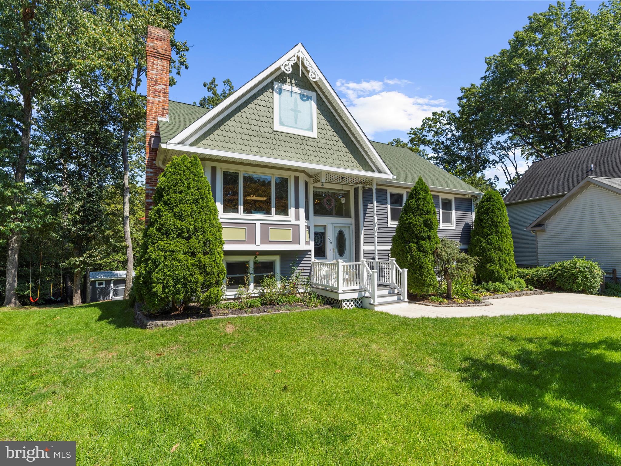 Nestled in a quiet cul-de-sac within the desirable water-access community of Magothy Forest, this charming Victorian-style home offers 3/4 bedrooms, 3 full bathrooms, and water views! The home features soaring cathedral ceilings that fill the open concept living/dining/and kitchen with natural light, creating an airy and inviting atmosphere. Enjoy water view from select rooms, adding a touch of serenity to your everyday living. With its spacious layout, ample entertaining areas, and unique architectural character, this property blends classic style with modern comfort. Magothy Forest offers a community pier that is perfect for launching a kayak or paddle board, sidewalks, serene walking trails, and a tot lot/open field area. The back yard is your private oasis offering multiple decks and a beach bar area with water views! Community pier access is located next to 254 Whistling Pine Rd. Community tot lot access is next to 142 Wild Oak Rd. Community walking trail access next to 287 Wilderness Rd.