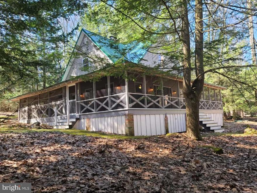 Goin slow in Black Mo!  Looking to kick back, relax, slow the pace of life and enjoy Pennsylvania's great outdoors?  Look no further!  This is a rare opportunity to own this exquisitely updated, fully furnished DCNR cabin on leased land in Black Moshannon State Park that has its own well and a septic tank.   Be enchanted by the moss covered stone walk leading you to a sprawling and inviting wrap around screened-in sleeping porch.  Remodeled from outside to inside, top to bottom you'll love the modern amenities and updated finishes combined with cottage-like touches and old-time character.  Taken down to the studs and lovingly rebuilt, you'll appreciate the high ceilings, modern windows and doors, original stone fireplace and staircase, and open concept.  The great room boasts high ceilings, LVT flooring, a French door to the porch, a wood-burning fireplace, and a modern kitchen with newer appliances and a wood-topped breakfast bar.  One bedroom and a full bath are on the main floor while upstairs you'll find a loft area, second bedroom, and a full bath.  With a heat pump for heating & cooling, a new well and septic holding tank, and new plumbing, electrical system, windows, doors, siding and a metal roof, all of the heavy lifting has been done for you.  There's even boat storage under the porch and plentiful parking.  Enjoy fun times in the backyard pavilion and at the fire ring, or grab some fishing gear and a boat, kayak or canoe and head across the street to the lake for a day on the water.  With top notch hiking & biking trails, fishing and hunting right out your side door and two mooring sites and a boat launch just down the street, you can't beat this fantastic location.  Other park amenities include a beach with play equipment and restrooms, an environmental center, a camp store, pavilion rentals, and much more.  Some restrictions apply, such as this camp can't be a primary residence, can't be rented, and must be owned by a Pennsylvania resident (see listing documents) and the new owner must be approved for a lease transfer by DCNR.  This is a turnkey camp of the highest quality in a terrific location just waiting for you and your adventures to come!