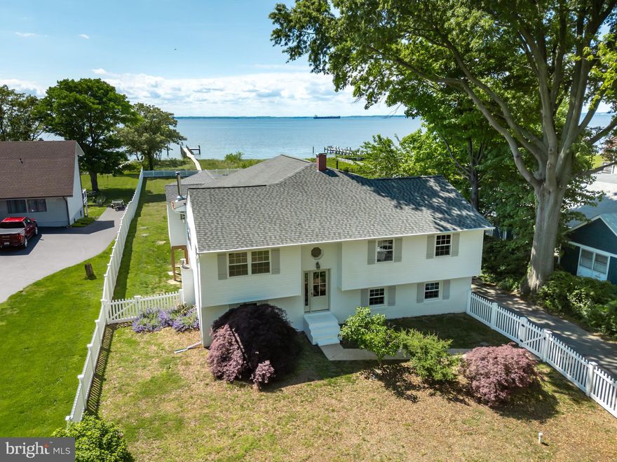 Notice-The Open House scheduled for Friday 8-9 from 4-7 has been cancelled due to the weather.
Along the stunning shores of the Chesapeake Bay, this breathtaking waterfront sanctuary invites you to indulge in coastal luxury and both nature and serene vistas. Situated on a generous .89-acre parcel of land, this meticulously renovated home stands as a testament to refined elegance and spacious living.

Step inside and prepare to be captivated by the sheer expanse of this remarkable residence. The open floor plan welcomes you with sophistication and captures both the costal vibe and seamlessly blend of modern design with timeless charm. Walls of windows adorn the waterside, bathing the interiors in natural light and offering uninterrupted panoramas of the bay’s waters and sunsets that only live here.

The heart of the home is a gourmet kitchen, thoughtfully appointed with top-of-the-line appliances, sleek countertops, and ample cabinetry. Adjacent, a cozy breakfast room beckons with the comforting glow of a wood stove, perfect for leisurely mornings and intimate gatherings.

This home boasts five bedrooms and two and a half baths, ensuring an abundance of space for family and guests. The master suite is a private retreat, complete with its own luxurious en-suite bath.
Entertainment opportunities abound, with both a formal living room and a two additional family rooms adorned with a welcoming fireplace, ideal for cozy evenings by the hearth.

Outside, paradise awaits. A gated yard ensures privacy and security, while a walkway leads to your private pier, for your boat and jet skis, offering direct access to the bay's shimmering waters. Imagine lazy afternoons spent lounging on the sandy beach, or evenings spent stargazing from the comfort of your own waterfront oasis.

Moreover, this property grants exclusive access to a communal beach area, further enhancing your coastal lifestyle with opportunities for recreation and relaxation. Close to restaurants, shopping and churches, approx. eight miles to bay bridge.

In every detail, this Chesapeake Bay front home exemplifies luxury comforts. With its unparalleled beauty, thoughtful design, and idyllic waterfront setting, it's more than a home—it's a sanctuary for your soul.