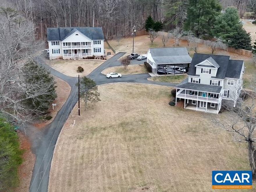 Built in 2006, this beautiful three-story home offers four bedrooms and 2.5 baths with an open floor plan designed for both everyday living and entertaining. The large kitchen flows seamlessly into the main living areas and is complemented by a family room with a stone fireplace, formal dining room, and hardwood and ceramic flooring throughout. The entire third floor serves as a private master suite with a spacious bathroom and walk-in closet. Each level has its own heat pump for year-round comfort.  Enjoy stunning mountain views from the front porch and relax on the wraparound porch. The fenced-in backyard provides privacy and space for pets or entertaining. The home sits on 2.01 acres with no HOA and a shared driveway. Behind the home is a 40? x 40? detached garage, separately metered, with space for four vehicles plus a motorhome or boat, plus an unfinished attic with exterior walk-up access for extra storage or future potential.  This home must be sold with MLS #672736. Price includes both homes. With 2 homes, this property is perfect for multi-generational living, a family compound or living in one while renting the other as long-term rental or Airbnb.