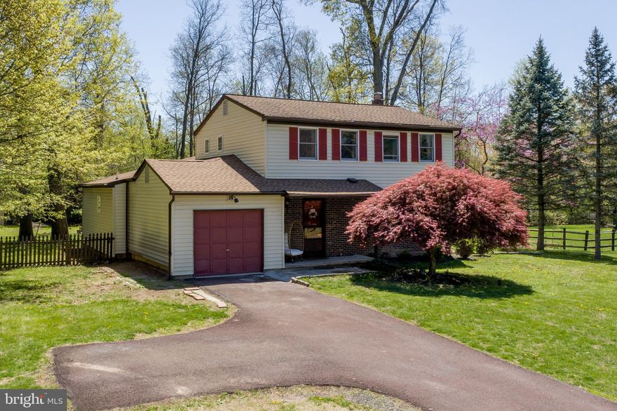 ***PRICE IMPROVEMENT*** Welcome to this beautifully maintained 5-bedroom, 3.5-bath Colonial, tucked into the sought-after Valley Woods neighborhood of Hatfield Township within the award-winning North Penn School District. Perfectly positioned on nearly half an acre, this home offers flexibility, functionality, and comfort for modern living—backing to township-owned greenspace for added privacy and tranquility.

A standout feature of this home is the dual *first-floor en suite bedrooms*—ideal for multi-generational living, guest space, or a private home office setup. The main-level layout also includes a versatile bonus room, convenient laundry, and an open-concept kitchen and family room combo that’s perfect for entertaining. The kitchen boasts abundant cabinetry, butcher block countertops, a kitchen island with seating, stainless steel appliances including a gas range with vented hood, and a beautiful stacked stone backsplash. The sun-filled family room features a vaulted ceiling and seamless access to the enclosed breezeway and rear deck—your go-to spot for summer relaxation and BBQs.
Upstairs, you'll find three more generously sized bedrooms and a full bathroom, including the original primary suite with a walk-in closet, vanity area, and shared bath access.

The home has been **pre-inspected**, including a separate roof inspection, providing peace of mind to the next owner. Additional highlights include hardwood floors, a powder room off the foyer, an oversized 1-car garage, and a basement with walk-out Bilco doors—ready to finish or use for storage.

Located just minutes from Routes 309, 202, and the Colmar train station, plus local dining and shopping, this home offers a perfect blend of suburban charm and commuter convenience.
**Don't miss this rare opportunity to own a flexible and functional home in one of Hatfield’s most desirable neighborhoods—schedule your showing today!**