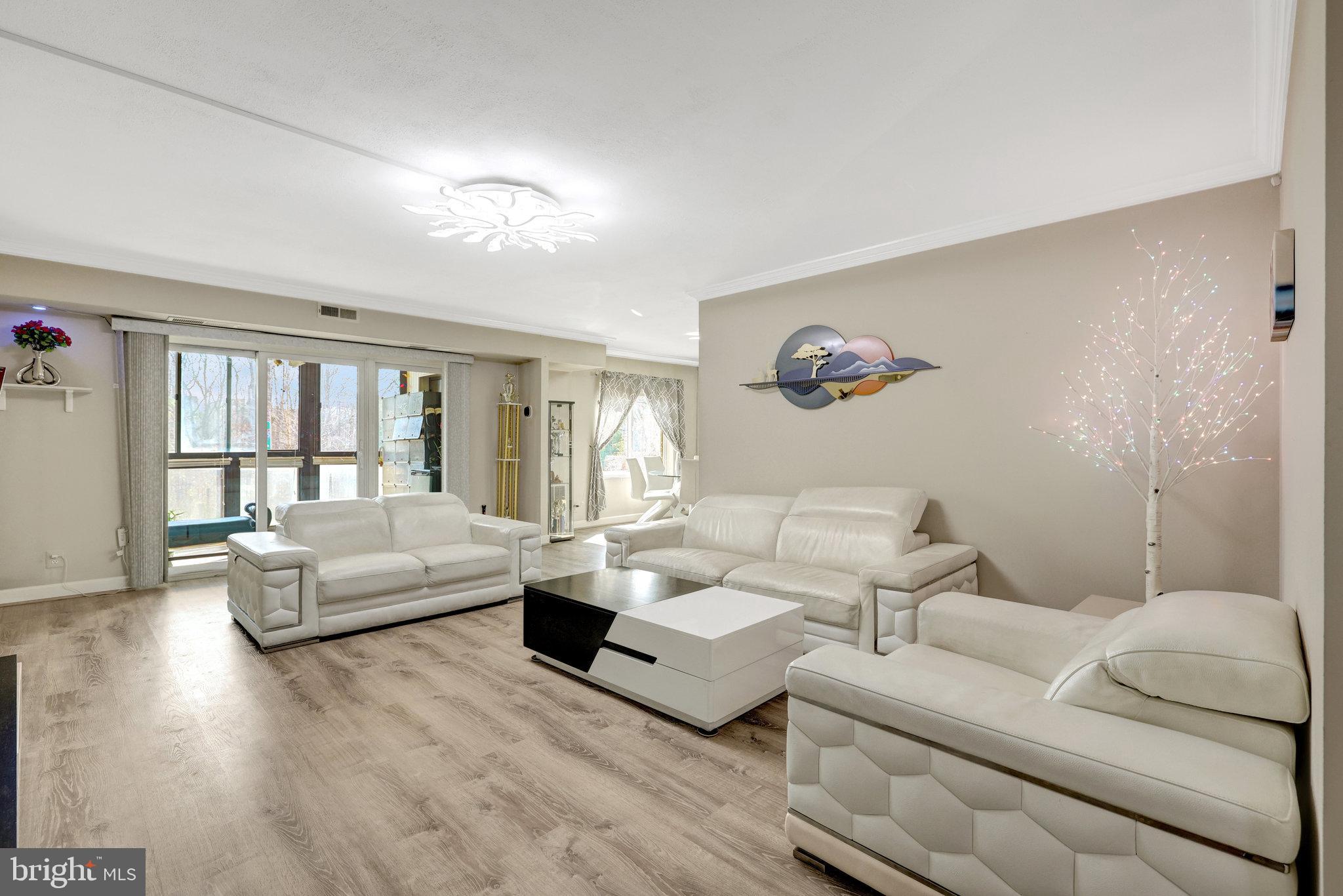 Welcome to 8340 Greensboro Dr #112. This is a rare opportunity to own one of just 10 first-floor “J” model units at The Rotonda. This property is truly a unique offering that boasts over 2,100 square feet of beautifully designed living space, featuring 3 spacious bedrooms, a sunroom, and a versatile bonus room that could be used as a 4th bedroom, home office, or den. Completely renovated in 2021, this turnkey home showcases a gourmet kitchen highlighted by quartz countertops and a quartz backsplash on both sides of the kitchen, giving a grand look. Added additional cabinetry in the kitchen for extra storage space. The updated kitchen includes new stainless-steel appliances, a new washer-dryer, and two new HVAC units. The home features engineered hardwood floors throughout, two brand-new bathrooms, and an expanded walk-in closet in the primary bedroom. The modern open floor plan is ideal for entertaining, seamlessly flowing between the living room and outdoor space. Adding to its exclusivity, this is the only unit in the entire complex with its own private entrance and exit. Enjoy the convenience of luxury condo living with the feel of a private residence. One garage parking spot and one storage space are also included. The Rotonda offers resort-style living set on a beautiful 34-acre gated site and easy access to Tysons, the Dulles Corridor, and Washington, DC. Amenities include 24-hour gated access, a state-of-the-art fitness center, tennis courts, a volleyball court, a library, indoor/outdoor pools, a game room, a men’s and women’s locker room, a hot tub, a sauna, a community center, walking trails, a dog park, car wash, lounge, and children’s play area. Move right in and experience spacious, sophisticated, and effortless living in the heart of Tysons!