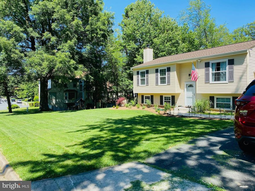 This beautiful 5-bedroom, 3-bathroom, Split Foyer house is ready for you to make it your home! Hardwood floors throughout the main level, beautiful tile floors in the kitchen with updated cabinets and stainless steel appliances. On the first level you will find a main suite and two additional bedrooms with a hallway shared bathroom. On the lower level, you will find a cozy wood burning fireplace and living area along with two additional bedrooms and a full bathroom. The full washer and dryer are also on this level. A full-sized utility sink is handy near the laundry units along with a walk-out to the back yard. The oversized double car garage allows ample room for parking and storage. Located on a spacious lot in a highly sought-after neighborhood, this home boasts a large fully fenced backyard with a stone patio great for entertaining at the base of a large deck allowing access to the off-kitchen dining room. Dogs are welcome, sorry no cats.