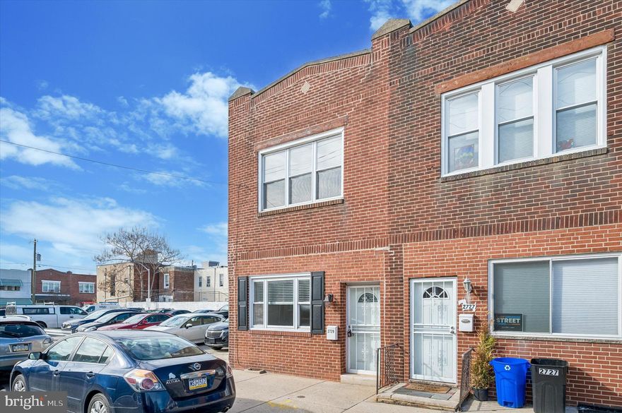 Welcome to 2729 Reed Street! This light-filled 3 bedroom, 1.5 bathroom end-unit townhome is perfectly positioned in the Grays Ferry neighborhood of Philadelphia—close to Graduate Hospital, CHOP, UPENN, and Drexel. Whether you're an investor looking for a high-performing turn-key rental or a homeowner looking to build sweat equity in a growing neighborhood in the city, this property is a rare find. The home sits directly adjacent to a public municipal parking lot. As long as your tags and registration are current, you and your guests can park for free—a massive value-add for the area. Clean, functional, and move-in ready, the main floor offers a seamless flow from the bright living area into the dining space. The kitchen is fully equipped with newer stainless steel appliances and leads directly to the backyard. The backyard is a generous size, perfect for a garden, patio, or grilling set up. Upstairs, you'll find three comfortably sized bedrooms with large windows. The basement provides ample storage and laundry hookups, while the half-bath on the main level adds essential convenience for guests and entertaining. This home was meticulously maintained by its previous owners, allowing you to move in immediately and take your time giving it the TLC and upgrades needed to truly make it your own.