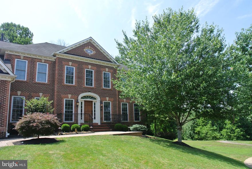 Spectacular NV Monticello in a prime Villages of Urbana location. A home like this comes on the market once every five years! Entertainer's dream backyard! Seller spent over $100K on  backyard upgrades: deck, patio, screened-in room, stone fireplace & professional landscaping! One of the best lots in Urbana--fenced, backs to woods with a tranquil park-like setting and easy access to walking trails! Fantastic fully finished basement with movie room, full bar, recreation area, work-out room, bedroom, full bath and extra storage! Plus 3 car garage with extension.