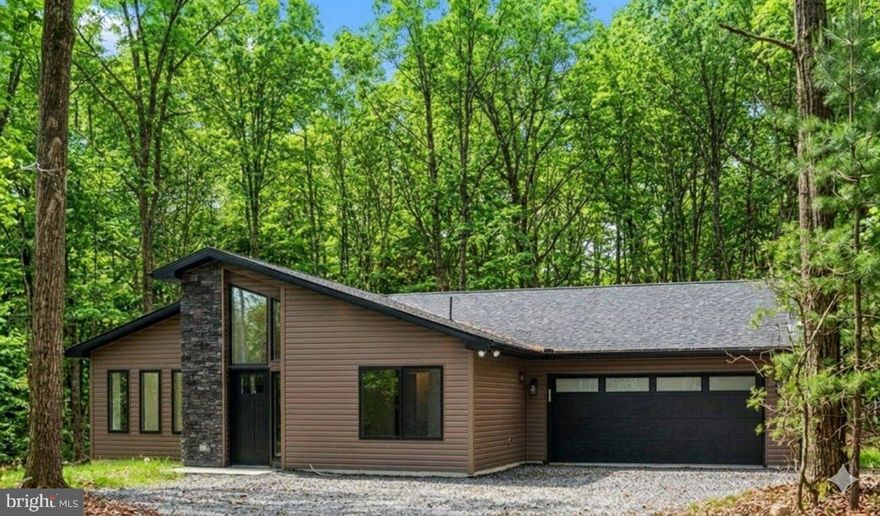 Rare find. Lake community, but no HOA.  Newly built custom Mountain-Modern ranch-style home on a stunning 1-acre property walking distance to lake.  This 4-bedroom, 3-bathroom home features three private master suites with custom tile showers. The gourmet kitchen features an eating island that seats 10, with quartz countertops, soft-close custom cabinetry, pendant & recessed lighting and exceptional stainless-steel appliances.

 

At 1837 sq ft, this stunning design feels so much larger.  It features a large, vaulted-ceiling great room with a stunning stone fireplace, and walls of Andersen windows that flood the space with natural light from both the front and rear of the home.  Step out from the great room onto a wrap-around, custom stamped concrete patio with built in fire pit.  Each room enjoys super high-efficiency mini-split units (efficient to -20 degrees!), which will help keep operating costs way down.  An attached 20x20 garage offers lots of space for autos, atv’s and storage.   Just a short stroll from a private lake, beach, playground, pavilion, and kayak racks.  Penn Forest Township is STR friendly, so act now before the spring buying season brings multiple offers.  The seller has a working relationship with a PA licensed builder and realtor. If you prefer a different lot, location, or wish to customize the home, the same trusted team can build your home.  Contact the listing agent now to get started or to refer a client. Located near historic Jim Thorpe, Penn's Peak music venue, Big Boulder & Jack Frost Ski Resorts, Pocono Raceway, Lehigh Gorge State Park, Hickory Run State Park, Pocono Whitewater, etc. Easy access to PA-476 via PA-903.