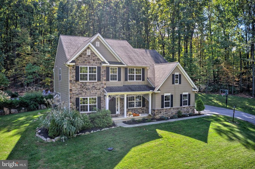 Due to Governor Tom Wolf s mandate regarding COVID-19, we are currently unable to allow any in-person showings of our listed properties.  Contact your agent for more information.If you're looking for a beautiful home with seclusion and privacy, this is the one for you! This custom home has extensive landscaping and sits on over 6 acres of land surrounded by trees and nature.  Once inside, you'll be impressed by the space. The first floor has 9 ft ceilings and hardwood floors throughout.  Also included on the first floor, is a huge eat-in kitchen with a dining area and separate island.  The family room has a beautiful gas log fireplace surrounded by stone with gorgeous views of the outdoors.  In addition, there is a separate dining room and office with a half bath to complete the main level.  The second floor offers a master suite with cathedral ceilings, a large walk-in closet along with a full bath with double vanities, a soaking tub, and walk-in shower.  You will find 3 additional bedrooms with walk-in closets on the second floor along with a convenient laundry room.  The backyard is an entertainers dream featuring an in-ground pool and patio area.  Covered front porch along with an over-sized 2 car garage and bonus workshop/storage area.  Be sure to schedule a showing today and see all the unique features of this home.