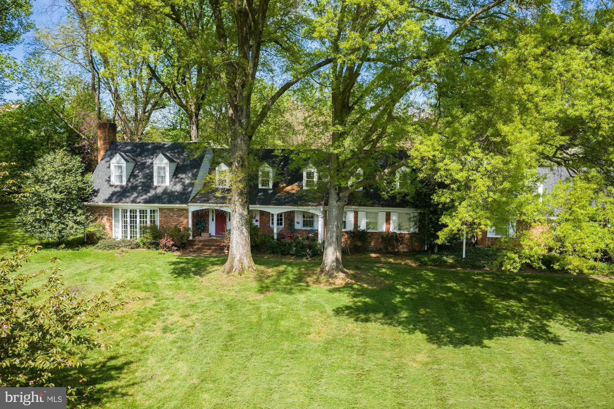 Take a look at the attached AERIAL VIDEO of this property to appreciate the beauty of this land. An incredible opportunity to own almost four estate quality acres in the heart of the Potomac Village. The picturesque site, with sprawling grasslands and mature trees, provides tranquil and private setting, perfect for a refuge from the bustle of Washington DC. Built in 1955, the original country estate included a charming Williamsburg colonial, a swimming pool, a cabana, and a barn. This classic "Old Potomac Home" was renovated sometime in the mid-nineties, at which time the property was connected to the public sewer. The two upper levels of the home offer 4600 square feet of living space. The elegant, embassy-sized living and dining rooms, both with fireplaces, a library/office with a wet bar, a country kitchen with a huge fireplace and a spacious keeping room/breakfast room, a family room just off the kitchen, a screen porch, a powder room, and an au pair suite are all located on the main level. Upstairs, there is a primary suite with a fireplace and two separate, en-suite bathrooms, tree spacious bedrooms, two additional baths and a walk-in attic. The finished lower-level room is perfect for a playroom or a media room. The home features hardwood floors throughout, lots of built-ins, both for display and for storage, and many windows and glass doors that bring in the natural light and offer great views of the grounds. Set on a bucolic street, just off the prestigious River Road, this property is located on a beautiful block with several multi-million $$$ properties, very close to the Village center (0.6 miles), and within an easy reach of major commuting routs, three airports, the area's fine shopping, dining, schools, and wide range of museums, sports venues, and cultural centers. Truly a one-of-a-kind property, unlike anything else in this area. Exceptional and rare opportunity to either renovate/expand the existing home or to build your own dream estate.
