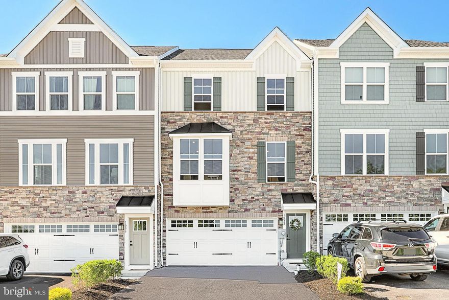 Featuring a 2 car garage, granite kitchen countertops, stainless steel appliances, and craftsman-style upgrades, all included in an amenity-rich community. Entering your main living level, you'll be greeted by your lavish gourmet kitchen island, open-concept layout, 9ft ceilings, and LVP flooring throughout the main level giving it continuous flow and making it easier to maintain a reception sure to impress any guest! Flanked by a full-width dining room on one side and great room on the other, the kitchen serves as the centerpiece highlighting this highly-functional space!  All windows have Plantation shutters permanently attached.   Upstairs, the Owner's Suite is more like an at-home spa experience than a simple bedroom - complete with generous walk-in closet, soaking tub, double vanity, and walk-in shower. Two bedrooms with double door closets, full hall bath. Entry level foyer has large family room.