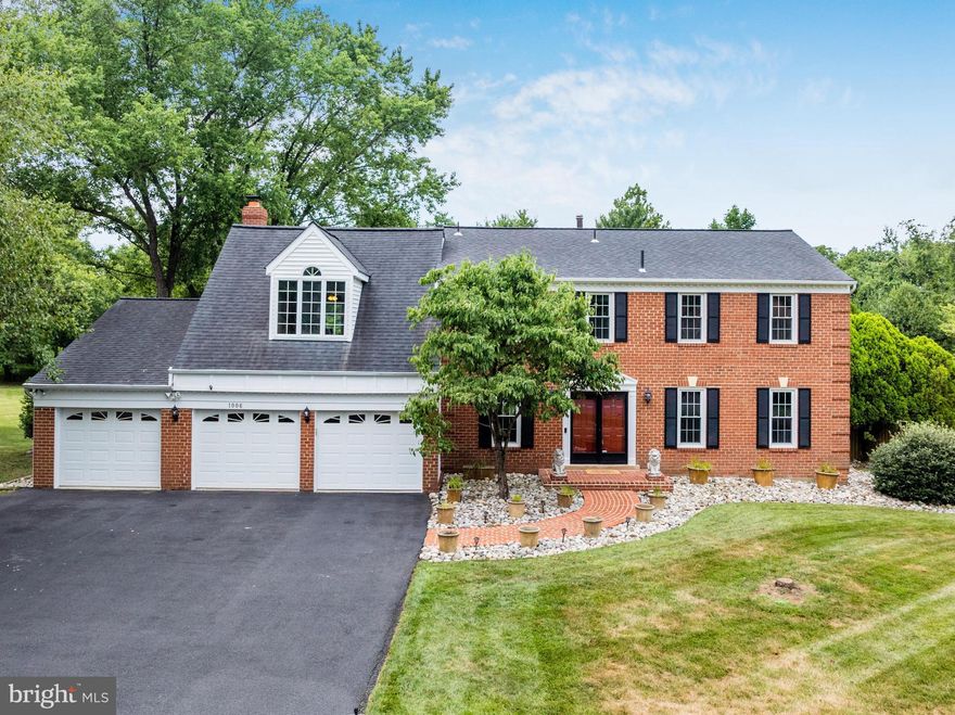 Introducing 1006 Cup Leaf Holly Court, an impressive brick front colonial in the desirable Holly Knoll neighborhood of Great Falls. Situated on a fully fenced-in half acre lot with a re-tiled and re-plastered dream backyard pool/spa combo and extensive hardscape.
Interior features include hardwood floors throughout, molding and trim, recessed lighting and more. The main level floor plan offers a private office space, formal dining room, and a cozy family room with a gas fireplace and charming brick accent wall. The kitchen features granite counters, and a new touch screen refrigerator. The main level is rounded out with a formal sitting room, half bath, and laundry. 4 generous bedrooms upstairs include two primary suites and an updated hall bath with separate vanities. The larger primary bedroom includes a brand new mini-split unit, a spacious walk-in closet and a spa-like bath with a soaking tub and dual shower heads. Enjoy the finished lower with a full wet-bar and a half bath. Use this space as a bonus rec room, or theatre room! Tons of storage space throughout including a 3-car garage with a separate bay that has the ability to be used as a gym!
Take full advantage of the backyard oasis this home has to offer. The deck, fence and retaining walls are all newly updated. Relax under the gazebo and host friends and family for pool parties all summer long. At night time, you can gather around the built-in fire pit. Explore your green thumb with raised garden beds and reap the benefits of the apple and peach trees. Two sheds are ideal for additional pool and yard storage.
Convenient location minutes to Great Falls Village Centre, Sugarland Crossing, Reston Town Center, and major commuter routes. Enjoy, and welcome home.