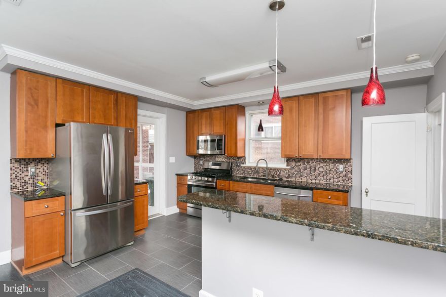 HUGE PRICE REDUCTION! Detached all brick colonial! Great corner lot w/ det. garage(garage being sold as is, but so much potential!) Granite counters, stainless appliances, 42" wood cabinetry, updated flooring, open gourmet kit. w/ recessed lighting, neutral paint, atrium doors to screened porch & fenced yd + side porch off living rm! HUGE MBR walk in closet! Nicely finished LL, full BA & wet bar!