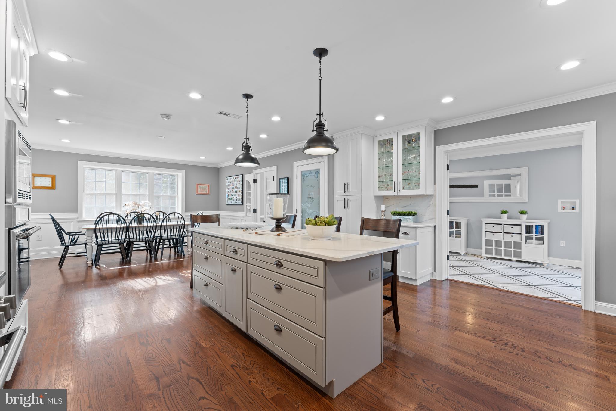 A Modern Masterpiece on the Main Line that is WALK-TO Ardmore's Shopping, Restaurants and Amtrak Train station? Yes, it has arrived!! Stunning and Completely Renovated this 8,755 sq. ft Luxury home nestled within a quiet residential neighborhood, blending modern sophistication with timeless elegance, offering premium finishes and top-tier craftsmanship throughout. BONUS: short walk to Ardmore Suburban Square, Ardmore train station for AMTRAK, Farmer's Market, Whole Foods, Trader Joe's, Wynnewood Shopping Center, and Lower Merion High School with its athletic fields, track, and tennis courtsAn exceptional luxury home, situated on a Level Fenced-in grounds with landscaping for all seasons and privacy galore. This home was Completely Renovated for today's lifestyle. Beautiful Hardwood Floors, Soaring ceilings, French doors, Skylights, and Walk-in Custom closets, this home echos elegance in every corner.
Main floor features a Large Sun Drenched inviting Living Rm with fireplace, an adjoining Office/den with built-ins, a spectacular Bedroom suite, with two walk-in closets and a striking modern bathroom. This room , which can be used as a Primary or Guest Suite, opens into the Stone Patio which overlooks the private fenced-in lush garden. Breathtaking Gourmet Chef's kitchen with an oversized island, High-End Thermador Appliances, ample cabinetry, Pantry Closet, and a large Dining space with windows galore overlooking the backyard. To the right of this showstopper kitchen is a massive mud-room with built-ins and an attached 2 car garage. A striking sun soaked Great Room, with a distinctive design, custom soaring ceilings with skylights, thoughtfully designed nook with built-in book shelves and window seating overlooking the meadow like backyard, a perfect place for game nights, sports events, gatherings.
The Second Floor boasts a huge (second!) Primary Suite, with a walk in closet and a luxurious Spa like bathroom. There are 3 additional Large Ensuite Bedrooms, each with its own beautifully designed bathroom, and one with a bonus Loft. Third Floor Bedroom suite includes a designer bathroom, two walk-in closets, a Cedar closet and an office space. Finished Basement is great for exercise or game nights and has a Walkout access. Beautiful Slate Roof, Copper Gutters and Downspouts, 4 Zone Climate Control, 2 Tankless water heaters.
Experience luxury living in one of the Main Line’s most coveted neighborhoods, while being stone's throw from all the restaurants, shopping, farmer's market and grocery stores!