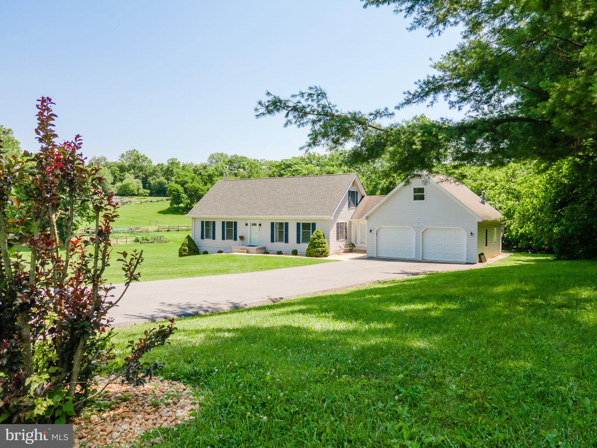 Here is YOUR CHANCE! Nestled on 3 private acres, this beautifully maintained 3-bedroom, 3.5-bath home offers the freedom of no HOA, space to breathe, and room to grow. Here's your chance to have that little farmette with the 5 chickens that can convey if you wish and a garden that's filled with blooming vegetables. Step inside this well maintained cape cod style home to be greeted by gleaming hardwood floors and an inviting floor plan that is sure to please. The main-level primary suite provides ultimate comfort and privacy, complete with a spacious en-suite that boasts a soaking tub, inviting you to relax and unwind. The two additional bedrooms and a full bath occupy the upper level of this charming home. A large, light-filled, country kitchen provides the perfect spot to enjoy a nice breakfast with those fresh eggs you'll get from the laying hens. And, an abundance of cabinetry and granite counter tops provide functionality with a modern flair to this kitchen that flows seamlessly into the dining space. The fully finished lower level expands your possibilities with its second kitchen, full bath, and flexible living space—ideal for guests or maybe even the in-laws. The newly installed wood stove in the lower level will keep you cozy while the newer roof with warranty, HVAC system, water softener and water heater all less than 4 years old will give you peace of mind. The attached oversized 2 car garage is perfect for the car enthusiast, offers a 220A electric and boasts an unfinished loft accessible from the exterior; perfect for creating a little airbnb, hobby room, office or anything else that you can imagine. Outside, the expansive maintenance free deck and patios provide the perfect setting for outdoor dining, entertaining or simply enjoying the tranquil surroundings. The property backs to trees, ensuring privacy and picturesque views. With invisible fencing the pets will love the property just as much as you! There is also a 30' x 20' building with electric offering additional space for hobbies, equipment or storage. Experience the comfort and charm of this amazing property, where every detail has been thoughtfully designed to create a true sense of home. Whether you're dreaming of a mini homestead, multigenerational living, or simply a quiet space with modern updates, this property delivers. Peace, privacy, and practicality —just minutes from major commuter routes creating an easy life style with an easy commute!! Proximity to VA, MD, DC commuter routes and Rail Stations.
Schedule your tour today and come experience the lifestyle you’ve been searching for. ****Professional photos coming soon****