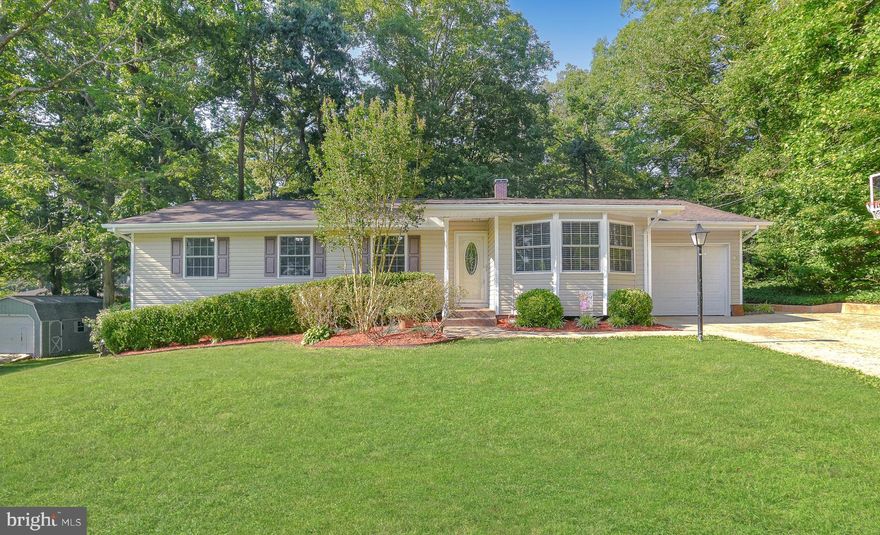 Beautifully Renovated Home on a Huge Corner Lot perfectly located across the street from the St. Andrews Estates Park and Fields. Hardwood Floors Throughout. Bright Kitchen with Stainless Appliances, Gleaming Granite, Large Pantry and a Breakfast Bar with Additional Seating. Charming Dining Room. Large Living Room with a Cozy Gas Fireplace and an Eight (8) Foot Sliding Door that brings in Beautiful Natural Light and overlooks the Private Backyard Backing to Trees. Lovely Primary Suite with Fully Tiled Ensuite Bathroom. Three Additional Bedrooms and an Additional Fully Tiled Hall Bathroom.  Full Washer and Dryer Convey.  

Fabulous Patio off the back of home offers an Additional 350 sq/ft Space for Relaxing and Entertaining.  White Composite Privacy Fence surrounds the Backyard.  Gorgeous Stamped Concrete Driveway and Sidewalks wrap around the home with Enchanting Landscaping ready to enjoy. One Car Attached Garage and an Additional One Car Detached Garage/Shed. Plenty of Parking. No HOA!  Only 5 Minutes from Shopping/Restaurants/Gym, 10 minutes from Hospital and 12 minutes from Pax River NAS. It is obvious the Sellers put Love into this Charming, Happy Home.