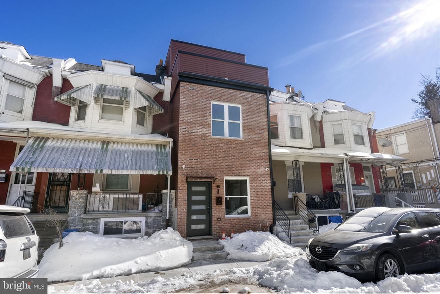 Welcome to 458 W Earlham Terrace, a newly constructed townhome presented by a local boutique builder, offering over 1,815 sq. ft. of thoughtfully designed living space paired with modern luxury finishes throughout. Step inside to soaring 9’+ ceilings and a sun-drenched living room that immediately sets a warm, inviting tone. The open-concept main level flows effortlessly, highlighted by engineered hardwood flooring that enhances both style and functionality. The gourmet kitchen is truly the heart of the home — designed for both everyday living and entertaining — featuring: Stainless steel appliances, Quartz countertops, Contemporary designer backsplash, Classic white shaker cabinetry, Pantry closet and dedicated wine & coffee station with built-in wine fridge.  The second level offers two generously sized bedrooms, a full hall bathroom complete with soaking tub, and a convenient laundry area equipped with front-load washer and dryer. Occupying the entire third floor, the primary suite serves as a private sanctuary. This retreat features: Private balcony off the bedroom, Oversized walk-in closet, Luxurious en-suite bath with dual vanity, Private toilet room  and frameless glass walk-in shower.  Outdoor living is equally enjoyable with a fully fenced rear yard, ideal for relaxing or entertaining guests. Additional highlights include: Tankless hot water heater, New HVAC system, Fire sprinkler system 10-year tax abatement and 1-year builder warranty.  Perfectly positioned just blocks from the vibrant Germantown Avenue commercial corridor, residents enjoy convenient access to Chestnut Hill, Center City, major transportation routes, and Fairmount Park. Experience the very best of Germantown — a neighborhood celebrated for its historic architecture, cultural diversity, and strong sense of community.