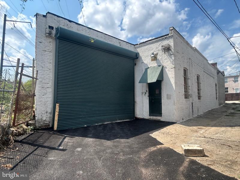 almost 7,000 Square feet of warehouse space. Private offices and bathroom. Drive in large enough for commercial truck, near railroad track. Storage and tool workshop. Current use is for auto on large tracker tailor/semi-trailer truck. New lighting added, clearance raised and concrete floor rebuilt. New pictures coming soon.