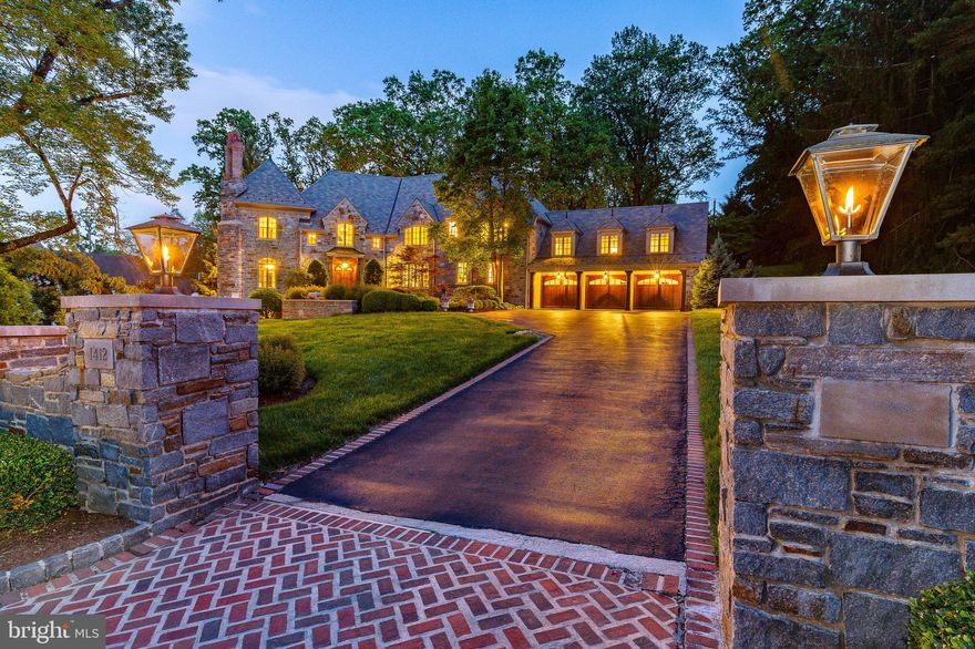 Real estate taxes are under appeal.  Based on the County's current assessment, a substantial reduction may be possible.

Elegant Stone Manor in Villanova’s Estate Area.  Set on 1.23 landscaped acres in Villanova’s prestigious estate neighborhood, this exceptional stone manor—designed by Fred Bissinger—blends timeless architecture with modern luxury. Hand-laid fieldstone, refined detailing, and a slate and copper roof create a striking first impression, while inside, thoughtfully designed spaces offer both grandeur and comfort.

A dramatic foyer introduces high ceilings, intricate millwork, and gracious proportions. The cherry-paneled study with fireplace and oversized windows provides an ideal home office. The formal dining room, served by a butler’s pantry, is perfect for entertaining. The living room features another fireplace and a wall of windows overlooking the grounds. The spacious family room, anchored by a floor-to-ceiling stone fireplace, opens seamlessly to the chef’s kitchen—appointed with premium appliances, custom cabinetry, large center island and built-in Miele coffee & cappuccino maker. The sunlit breakfast room with vaulted ceiling and wraparound windows captures views of the gardens beyond. Additional first-floor amenities include a mudroom, laundry room, and access to the 3-car garage.

Upstairs, a wide hall separates the primary suite from the secondary bedrooms. The primary suite includes dual walk-in closets, a spa-inspired bath with radiant floors, steam shower, soaking tub, and a vaulted-ceiling sitting room—a stunning retreat that may serve as a second office. Four additional bedrooms each feature custom en-suite baths and walk-in closets. A rear staircase leads to the secondary bedroom wing, perfect for guests or live-in support. A walk-up attic offers extensive storage.

The lower level, bathed in natural light through a wall of windows and glass door, feels like an extension of the main living space. It includes a 3,000-bottle wine cellar with tasting room, a recreation room with fireplace, media area, game space, and an exercise room that can double as a guest or au pair suite with a full bath and private entrance—ideal for multigenerational living.

Outdoor spaces are equally impressive: two brick patios for dining and lounging, one with a built-in grill and sink; a stone fireplace with covered seating; mature plantings, lush gardens, and stonework that create a tranquil setting for year-round enjoyment.

With five fireplaces, cherry hardwood floors, extensive millwork, and recent mechanical updates including HVAC and security systems, this home is both luxurious and functional. Located just over a mile from the Philadelphia Country Club and within easy reach of Center City, King of Prussia, and Main Line shopping and dining, this is a rare opportunity to own a true estate property in one of the region’s most sought-after communities.