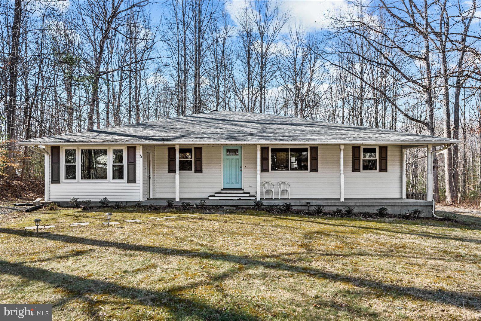 Remodeled home in private Lake community with access to beach with pavilion. Private 1 acre lot surrounded by mature oak trees. Everything in home is upgraded and new...windows, doors, kichen, black stainless appliances, bathrooms, flooring, HVAC, roof, water heater, electrical wiring, electrical service put in ground from street to house and much more. Main living area and kitchen has a vaulted ceiling. Home offers a beautiful country front porch as well as a back deck that was enlarged last year! Overlooks a beautiful yard and mature trees. Owner just installed a water softener system as well. Pristine condition!!