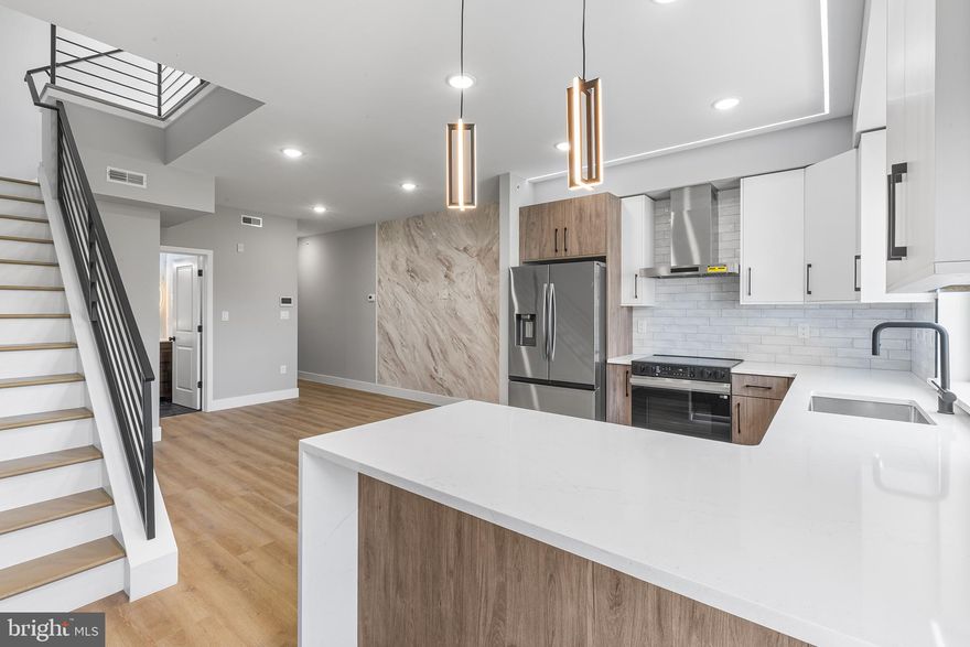 One of a kind new construction triplex located blocks from Girard Ave and Northern Liberties in the heart of booming Olde Kensington. 1413 N 8th offers an incredible opportunity for investors or owner-occupants seeking strong rental potential and luxury finishes. Each unit contains a unique finish palette and features a variety of designer lighting and plumbing fixtures, quartz countertops, stainless steel appliances, and modern open layouts with an abundance of natural light. Access to the private roof deck from the top unit provides unobstructed views of the Center City skyline. This offering is further enhanced by a 1-year builder warranty and a full 10-year tax abatement. Surrounded by thriving new development, vibrant retail and dining corridors in Northern Liberties and Fishtown, and just steps from one of the city’s newest pickleball and padel clubs, 1413 N 8th represents a standout investment in one of Philadelphia’s most dynamic and evolving neighborhoods.