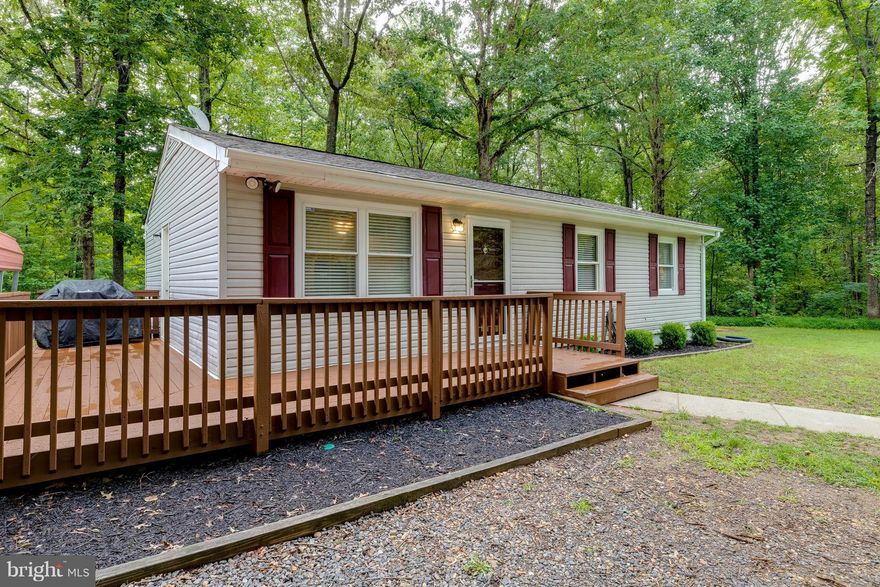 Peace & quiet to enjoy the outdoors while sitting on the wraparound deck watching the wildlife. Extremely private, flat lot with established trees in the rear. New water heater installed in 2016, high end Hague reverse osmosis water system, new front siding and exterior doors!  Fresh paint. Large driveway to store your RV with carport. NO HOA! 100% loan available via USDA. Cheaper than rent.