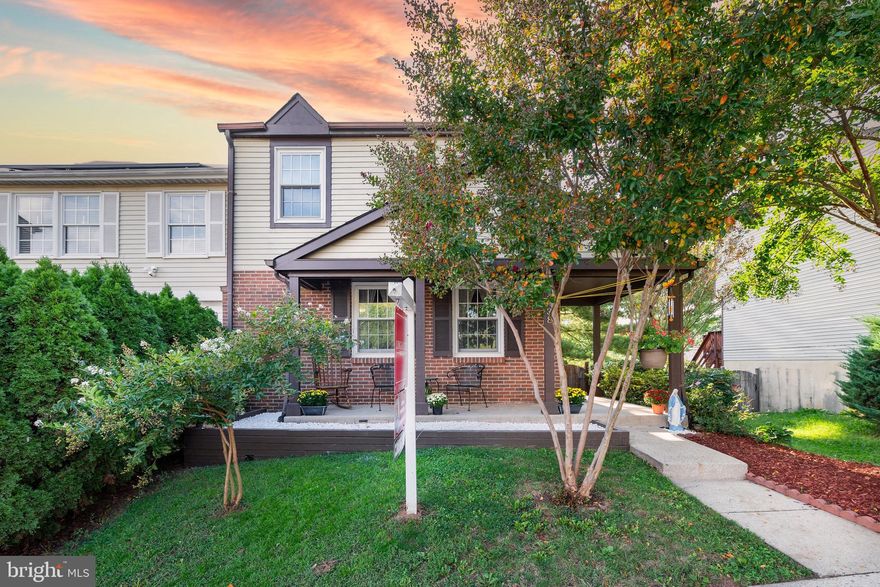 Beautiful end unit Town House with enclosed backyard.   The charming front lawn leads up to an outdoor sitting area.  This home has a lot to offer, featuring sleek hardwood floors, a beautiful brick accent wall with a cozy fireplace, ideal for the holiday season and cold winter nights.  Spacious L shaped kitchen, with lots of cabinet space.  Full size and finished basement, with a full bath and access to the back yard.  The 3rd floor has 3 spacious bedrooms and 2 full baths.  The owner's suit with private bath, has lots of space and abundant natural sunlight flows throughout.  The large deck can be easily accessed through the living room area, providing an extension to the living area.  Ideal for entertaining and hot summer days.  This solid deck, has built-in sitting and a great view and access of the backyard.  Freshly painted, recently updated roof, and new landscape.   Plenty of additional street parking on Ridgecrest dr.  Conveniently located, near shops, parks, restaurants, main roads, public transportation and much more!