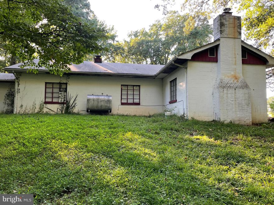 4+ acres and a little house in a wooded area of N Stafford. Walk to the Pharmacy and all types of services and amenities.  Walk to the bank, restaurants, grocery store and live surrounded by trees.  Unique opportunity.  Take a look.