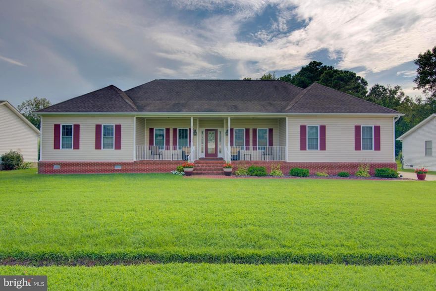 Discover this impeccably maintained 4-bedroom, 2-bath custom built home located in the heart of Colonial Beach, directly across the street from the river. From the moment you arrive, you’ll appreciate the charm and care that has gone into every detail of this property. The inviting front porch welcomes you into a warm, open interior featuring beautiful hardwood floors throughout the main living spaces and soft carpeting in all four bedrooms. Designed with comfort and accessibility in mind, the home features 36-inch-wide doorways and a thoughtful, flowing layout perfect for both everyday living and entertaining. The kitchen and living areas offer an ideal space for gathering, while the back of the home opens to a spacious deck that includes both a covered, screened-in section and an open area—perfect for outdoor dining or simply enjoying the fresh air. The fenced-in backyard offers privacy and plenty of space for pets, play, or gardening. A concrete driveway leads to a two-car garage, providing ample parking and even more storage. Speaking of storage—this home truly shines in that department, with an amazing amount of space available in both the attic and crawl space. Additional features include a whole-home generator for peace of mind during any season, and meticulous upkeep that ensures true move-in-ready condition. Whether you’re looking for a full-time residence or a weekend retreat, this home combines comfort, space, and location in one beautifully maintained package. Don’t miss this rare opportunity to enjoy life in Colonial Beach with a home that has it all.