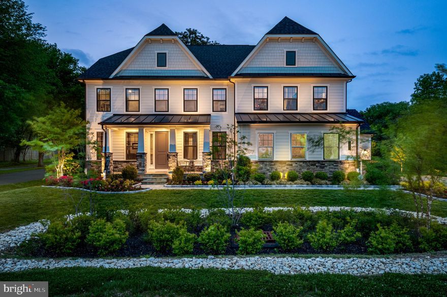 This magnificent five-bedroom, six-and-a-half-bath estate model home is perfectly located on a beautiful lot in the private Severna Park enclave of Ivy Hill. Custom built in 2020 with a nod to Coastal elegance and boasting over 6,400 finished square feet. This estate has high ceilings and ceiling fans in every room and the back porch, as well as a beautiful chandelier with an elevator lift making it easy to maintain, a spacious office with gorgeous bookshelves and plenty of cabinet space to store your supplies, a perfectly matched color palette, completed in eggshell paint throughout the entire house making it easy to clean, as well as architectural moldings and design-inspired details. Refined principal rooms create a spectacular venue for
entertaining, and transition seamlessly to cozy living spaces. The ultra high-quality interior is functional, elegant and meticulously crafted. This open-concept floor plan includes a main level guest suite with a bidet toilet seat, a entry way that opens up to a formal dining room with upgraded lighting in both areas, which can also be used as a stylish sitting room, remote controlled electronic honeycomb window blinds in the public areas and manual honeycomb blinds in the guest bedroom, the entire second floor, and basement areas. A stunning twostoried great room with an optional 200 inch projector screen and JVC D-ITA procision projector, that opens to the gourmet dine-in kitchen. The kitchen features an oversized Quartz Island with farmhouse sink and seating, gas range, GE stainless steel appliance suite, Quartz countertops, subway tile backsplash and designer cabinetry. The glass doors in the kitchen lead to the back porch where two gorgeous, fully grown, magnolia trees deliver the peace and tranquilly your heart desires, whether day or night as the trees have exterior lighting that shoots up from the ground exposing their majestic beauty. The second level hosts four generously sized bedrooms, all with ensuite bathrooms and spacious walk-in closets. The primary suite is the ideal oasis for relaxation with a sitting area, tray ceiling, two expansive walk-in closets, and serene spa-inspired bath which also has a bidet toilet seat and two vanities, glass enclosed shower, and soaking tub. Appreciate the convenience of second floor laundry with several storage closets throughout, an upgraded heavy duty folding attic staircase that can accommodate over 350 pounds. The finished lower level is simply gorgeous with a spacious recreation area, a full bar with seating to entertain your guest, full bathroom, a large glass door entrance that leads to the back yard, a personal gym, a dry sauna, and a large storage area with upgraded epoxy floors, a utility sink, and shelves to store your belongings. This estate also has many additional upgrades including the garages which are both insulated, and new heat and A/C ducts were added so both garages are heated and air-conditioned. Extra outlets were added for ease of use and both garages are fully finished with epoxy flooring and painted with eggshell paint making it easy to clean the walls by simply wiping them down. If your looking for safety this house is it! With 3M security film on every window in the house its extremely difficult to break through the glass and also protects against high wind scenarios. All exterior doors as well as the master suite have reinforced doors and hinges with night lock security door barricades. All upstairs bedrooms have Werner 2-Story Fire Escape Ladders built into the wall making them aesthetically pleasing to the eye, and a Trinity Home Security Monitoring and Video Surveillance System connected to a DVR system that records 24/7. Further enhancing the appeal of this special property is the stone walkway and gorgeous exterior lights that make the estate look even more grandiose, and a sprinkler system that maintains the immaculately landscaped grounds brimming with beautiful flowers, bushes, and trees.