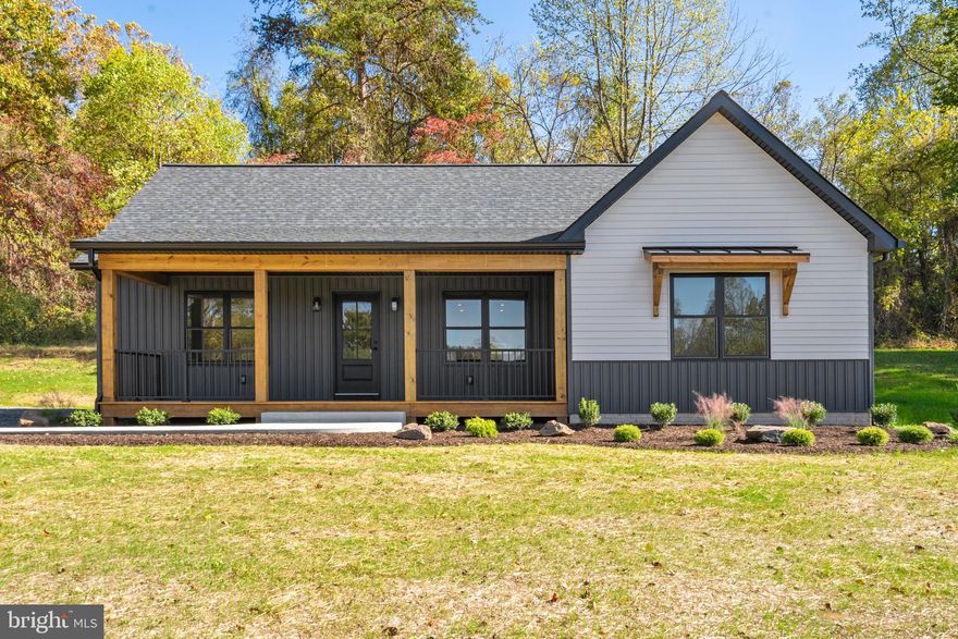 Welcome to this stunning, brand-new home, located on a peaceful 3 acres in Madison county!  It’s not your average spec home, and you’ll be amazed by the custom upgrades, attention to detail, and level of craftsmanship throughout. Enter the home from the large covered front porch, into the bright and open kitchen/living room, which features an island, granite counters, brick wall, stainless appliances, and recessed lighting. The owner's suite includes an en suite bath with double vanity, and a large walk-in closet with pull-down aluminum ladder attic access. There are two other spacious bedrooms and a full bathroom on the other side of the home. A large laundry/mud room is also off the kitchen, and includes a barn door, side exterior door, stainless sink, washer/dryer, utility closet, and built-in cubbies. Other features include LVP flooring, recessed lighting, Anderson windows, 30 yr architectural roof, gutter guards, 2x6 exterior framing, conditioned crawl space, premium vinyl siding, landscaping with stone, a rear exterior door with steps, and large driveway for parking. There are also some distant/seasonal mountain views. The property offers easy access to RT29 for commuters, and is only 5 miles from the town of Madison, 12 miles from the town of Culpeper, and 3 miles from Prince Michel winery!  Don't miss your opportunity to be the first owner of this amazing property!
