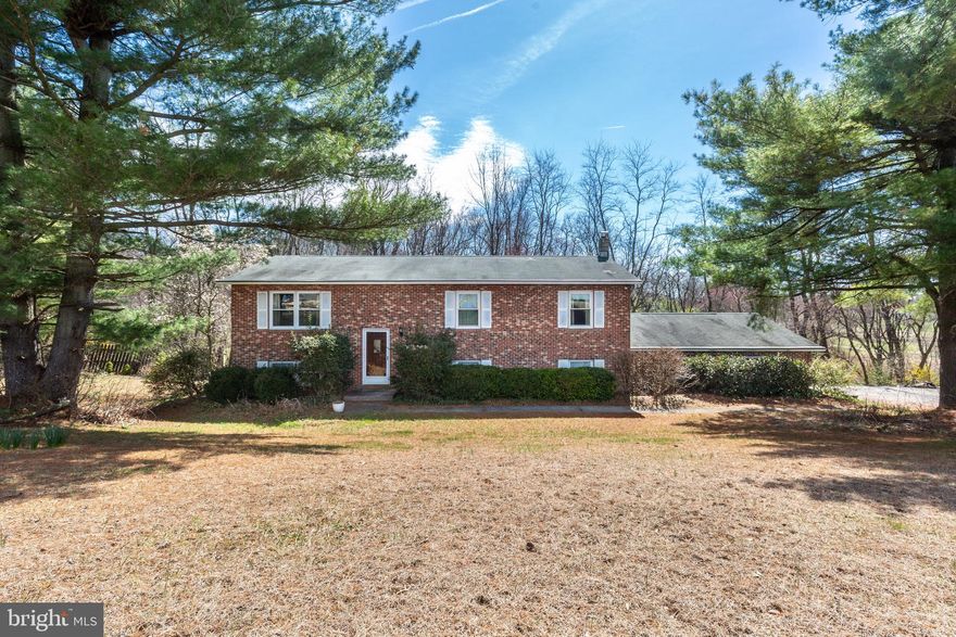 Opportunity awaits! This spacious 4 bedroom, 2.5 bath home is ready for its next chapter and offers great potential for buyers looking to add their personal touches. The split foyer layout features a bright living and dining room combination with ceiling fan, an eat-in kitchen with deck access, and multiple living spaces to spread out. The lower level offers a cozy family room with walkout to the backyard and a built-in bar that conveys, plus a wood stove rough-in for future warmth and character.
The home includes a two-car garage, laundry/utility room, and generously sized bedrooms including a primary bedroom that shares the hall bath featuring a jetted tub. Outside you’ll find a deck overlooking the yard and an above-ground pool (sold as-is).
With solid bones and plenty of space, this home is a great opportunity for someone ready to bring their vision and make it their own.